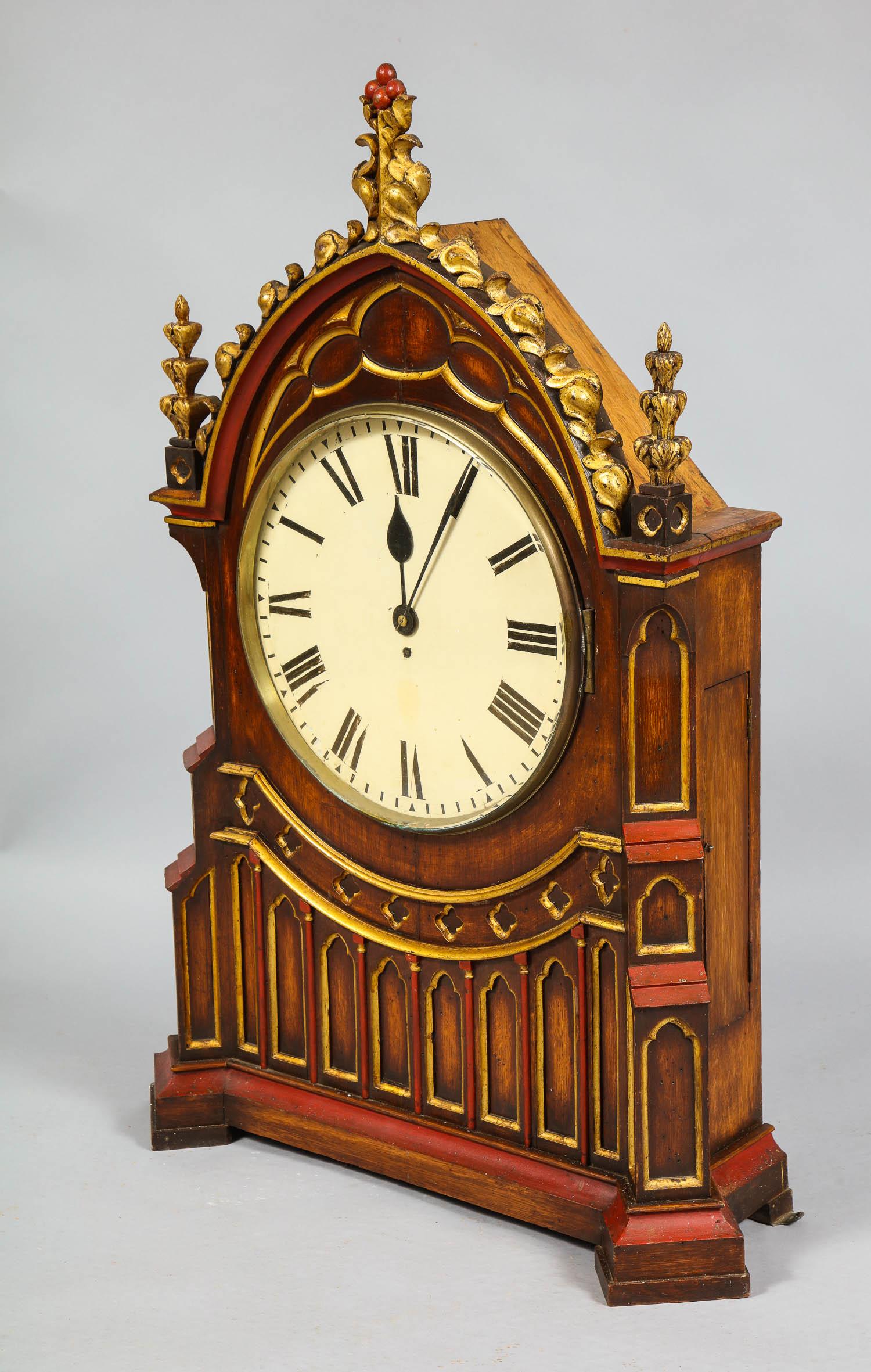 Very fine English early to mid-19th century Gothic clock of important scale having carved and gilt pediment and polychrome decorated case with trefoil tracery decoration, the movement a very fine 8 day timepiece with a fusee movement, unsigned.
The