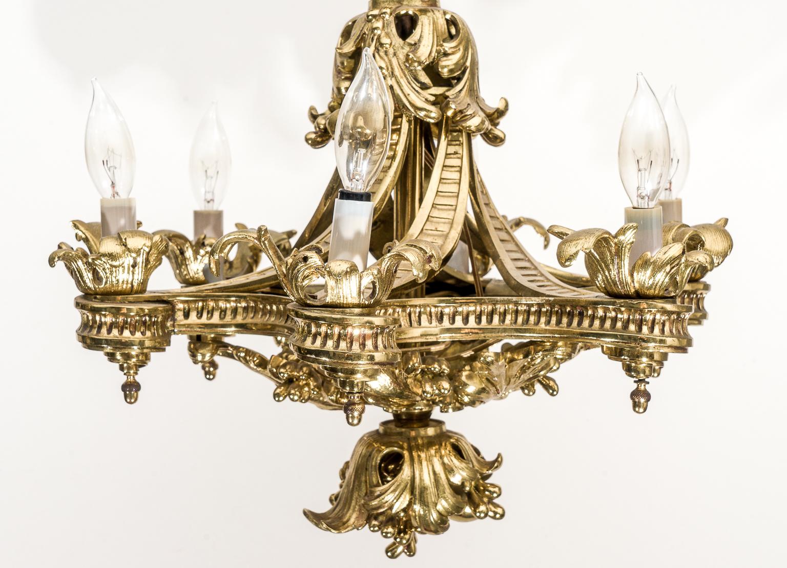 This stylish English bronze Gothic revival chandelier was acquired in London and it dates to the 1920s-1930s. The piece has been professionally polished.

Note: Requires six candelabras based bulbs.