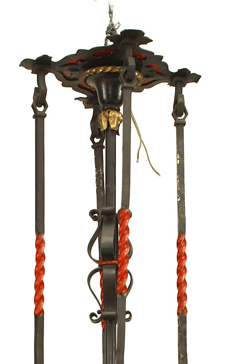 English Gothic Revival-Style (1920's) wrought iron 8 light octagonal shaped chandelier with mica shades & decoratively painted shields & scroll design with 5 extensions from a canopy.
