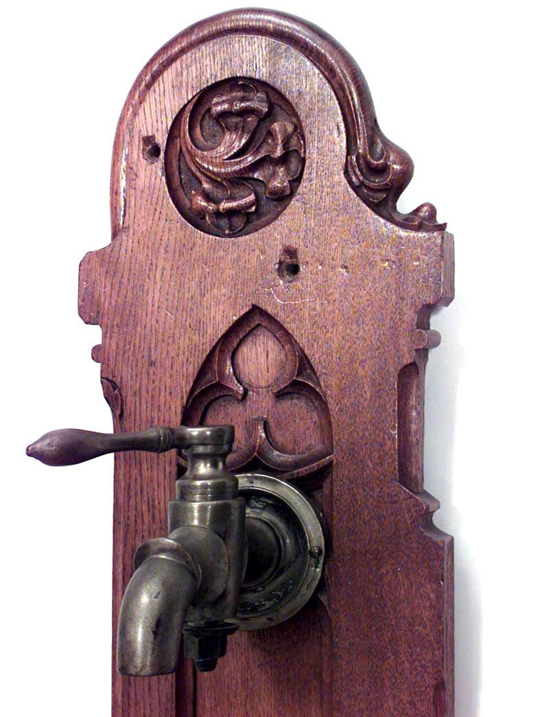 2 English Gothic Revival style (19th Century) bronze faucets mounted on oak wall plaque. (PRICED EACH).
 