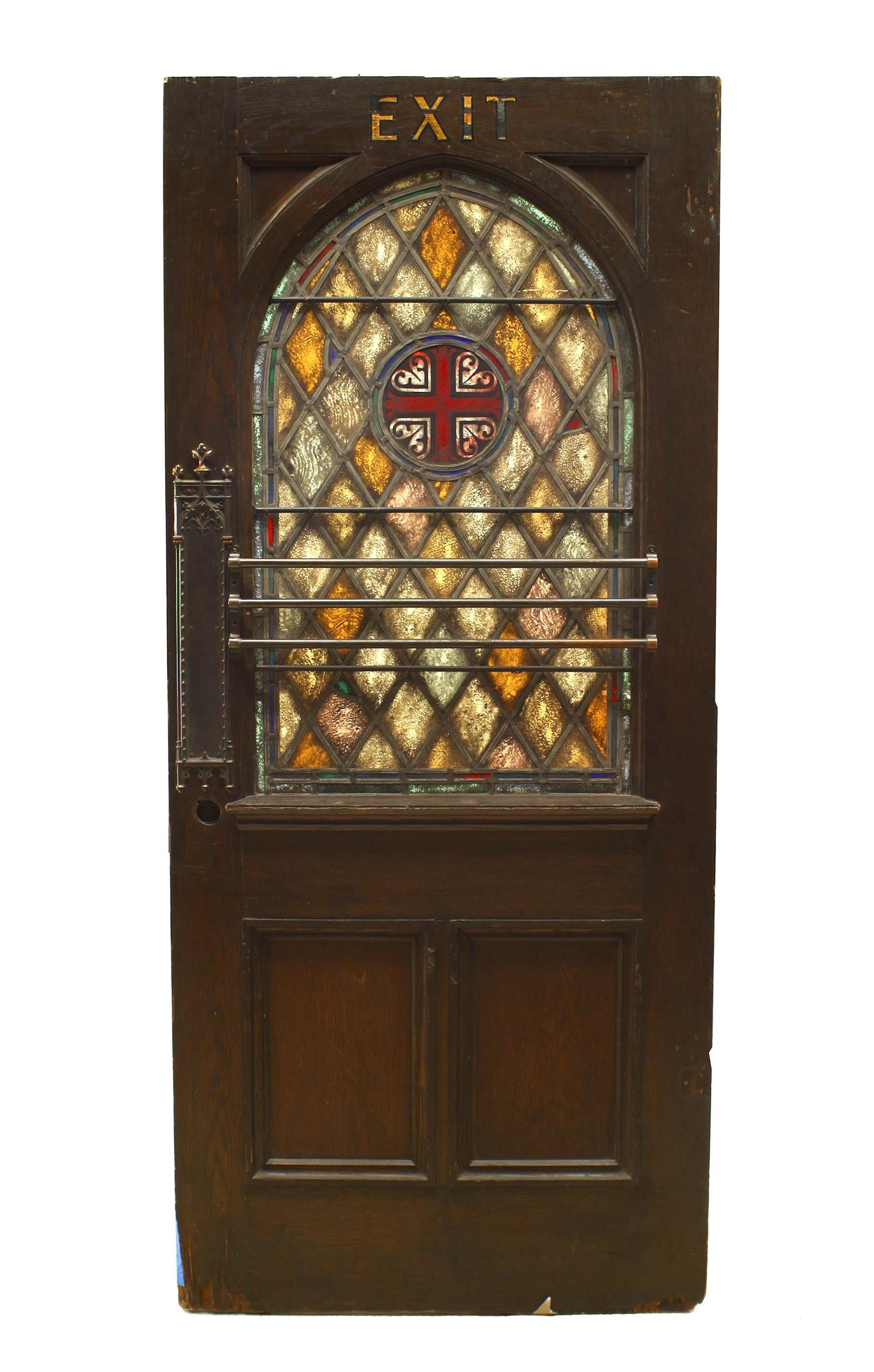 English Gothic style stained oak door with leaded glass panels and diamond design with cross, (19th century).