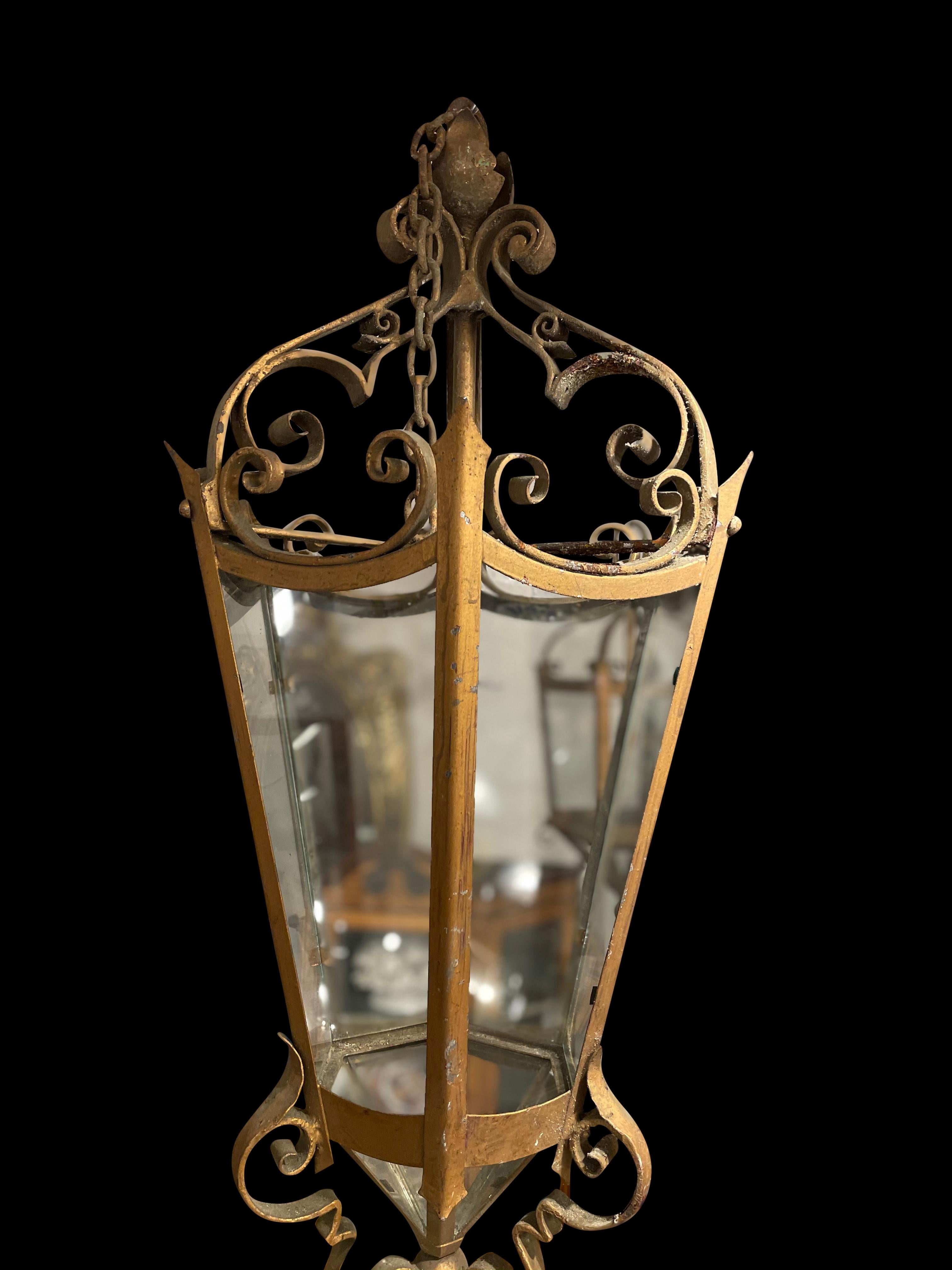English Gothic wrought iron 6 glass panel hanging lantern, 19th century.