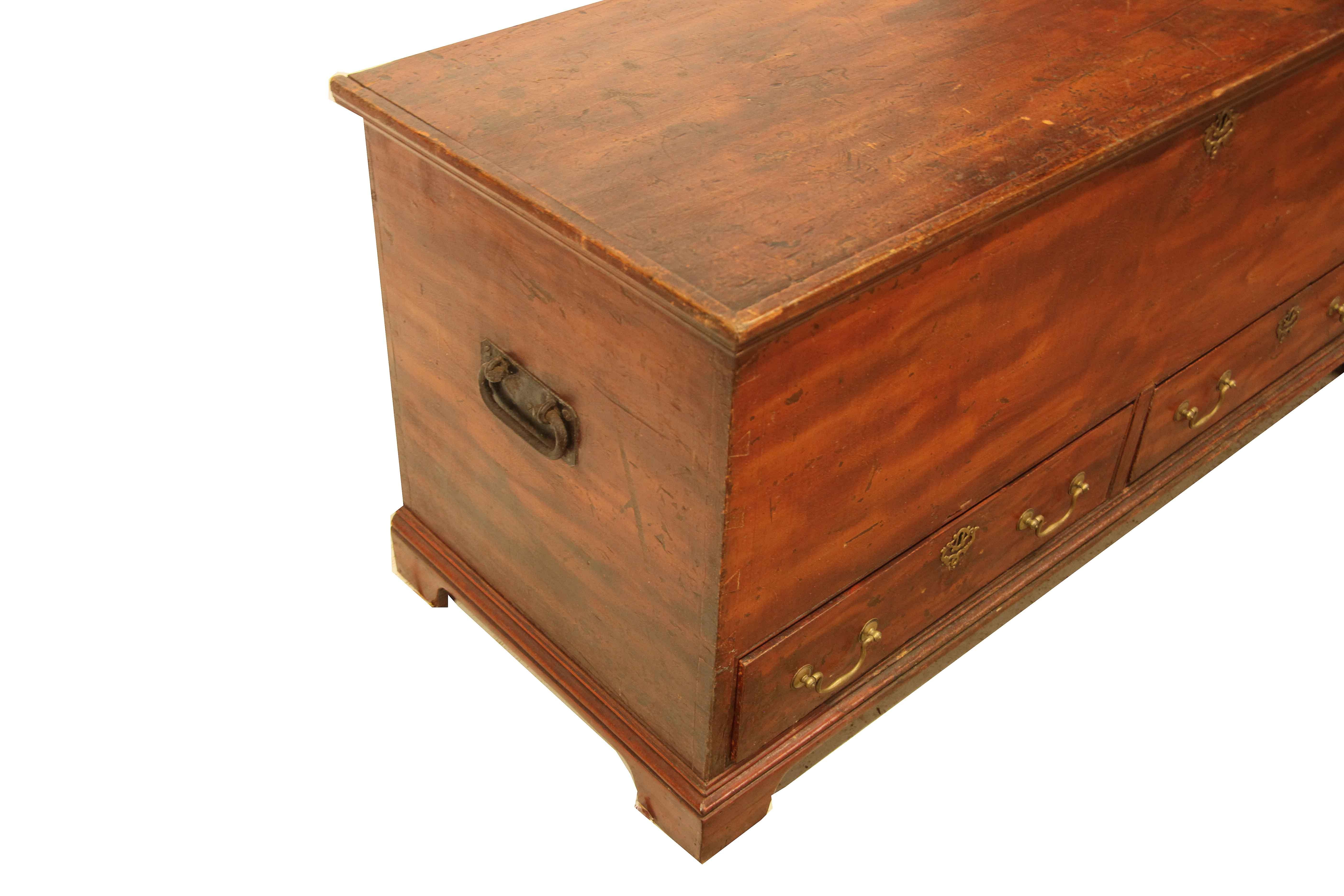 English grain painted blanket chest, entire exterior painted boldly with alternating dark and light shades, open interior with original steel hinges, candle box with lid above single drawer; sides with original steel carrying handles. The two