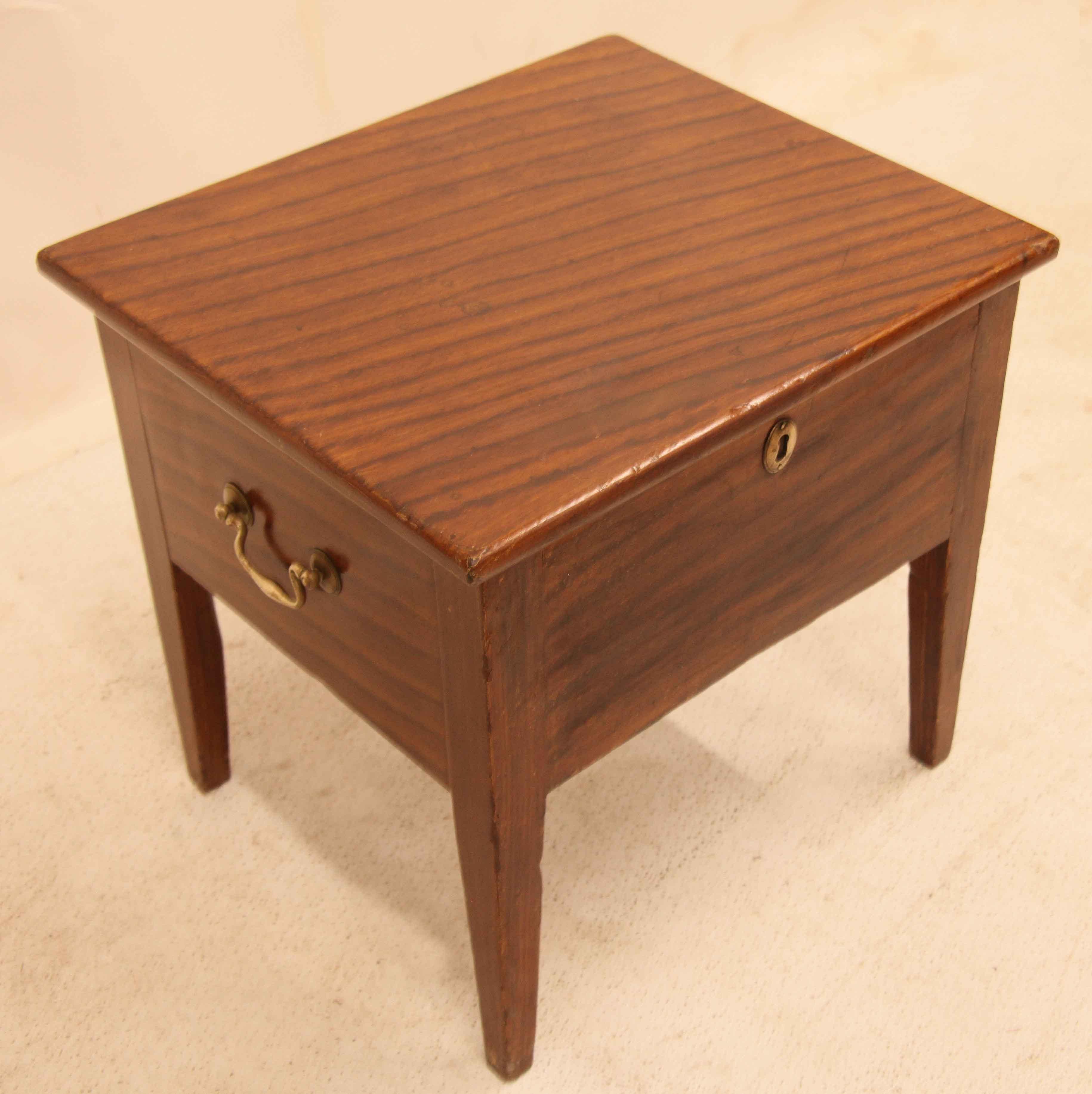 Englsih grain painted end table, this table was originally a commode as revealed when the top is lifted.  The original pottery potty is missing.  The entire exterior is boldly grain painted to simulate mahogany; the sides have brass swan neck