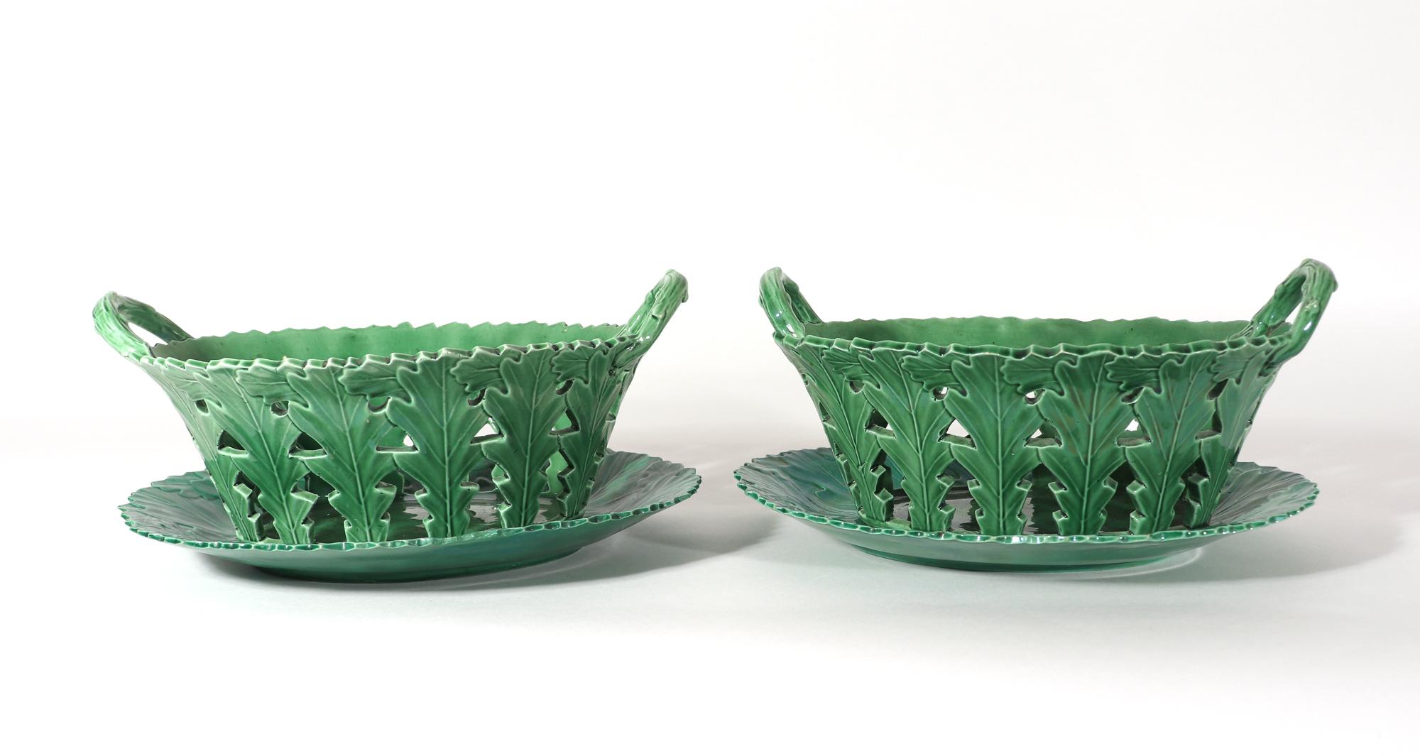 British green glaze oak leaf pottery baskets & stands,
Attributed to attributed to probably West Pans, Scotland, 
probably William Littler,
Circa 1770

The oval greenware baskets and stands have an oak leaf design. The baskets are openwork with
