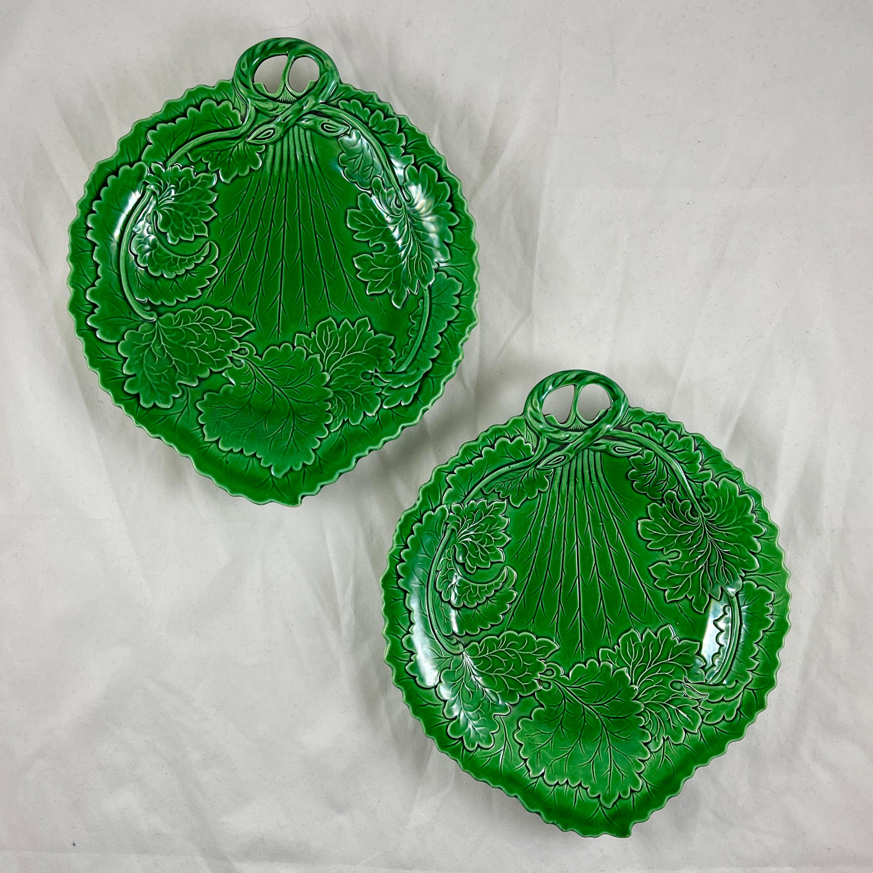 A majolica green glazed leaf pattern server, England, circa 1880.

A serrate edged leaf shaped platter with an open work twig form handle. Beautiful mold work showing smaller branching leaves following the oval form of a single large leaf. Deep