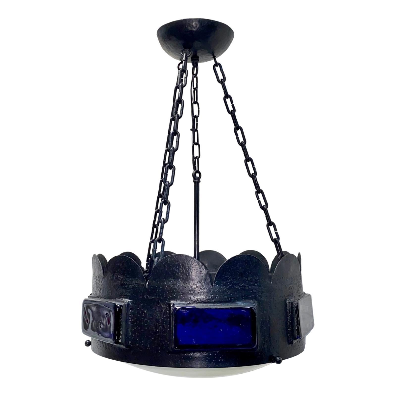 A circa 1920's English light fixture with cobalt blue glass insets, glass diffuser at the bottom and four interior lights.

Measurements:
Drop: 31