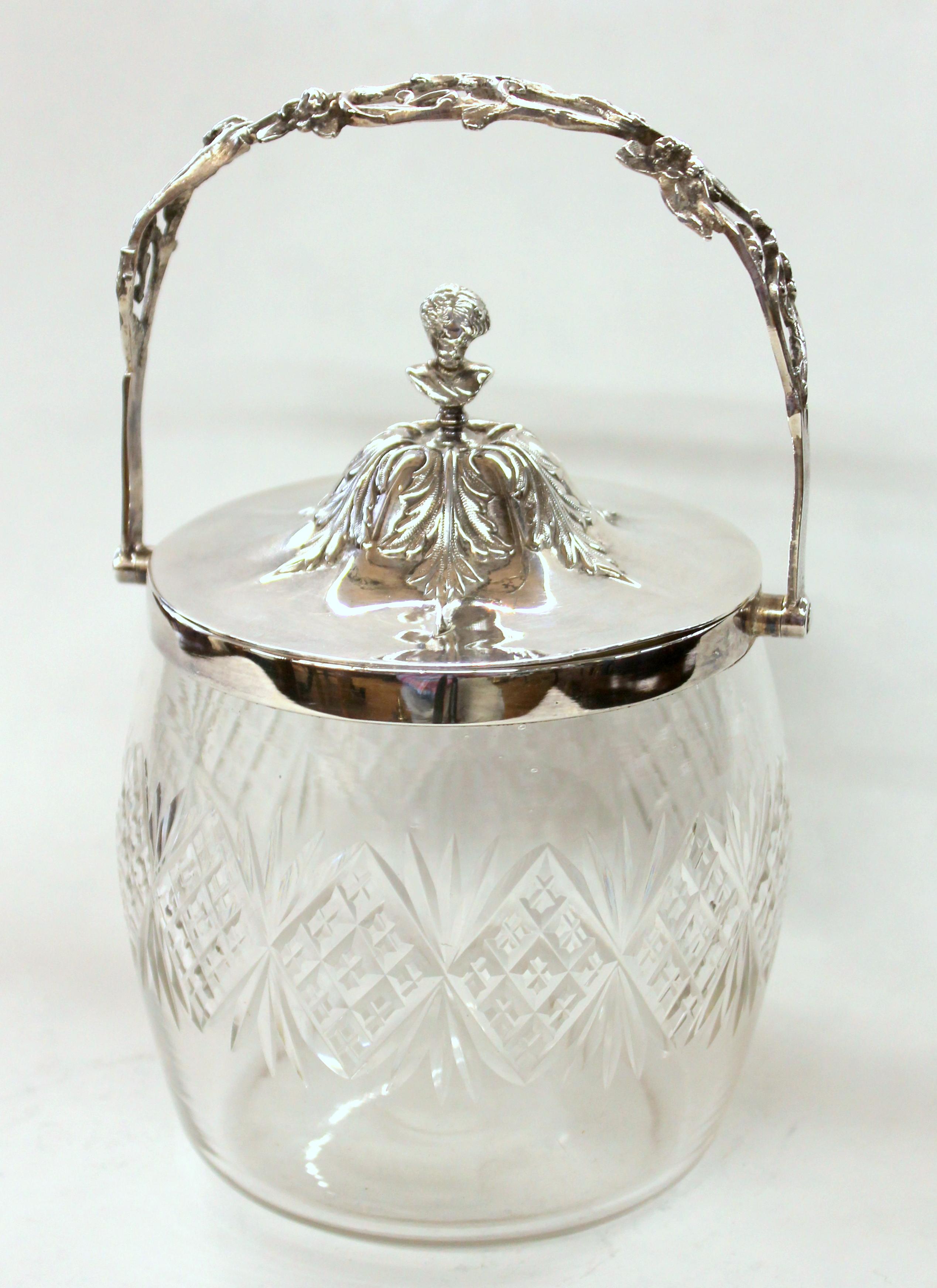 Superb antique English hand chased silver plate and cut crystal covered biscuit barrel or candy box with hand chased lid; lady's bust finial on lid. Nicely hand cut crystal barrel. Pristine condition. No plate loss.
 