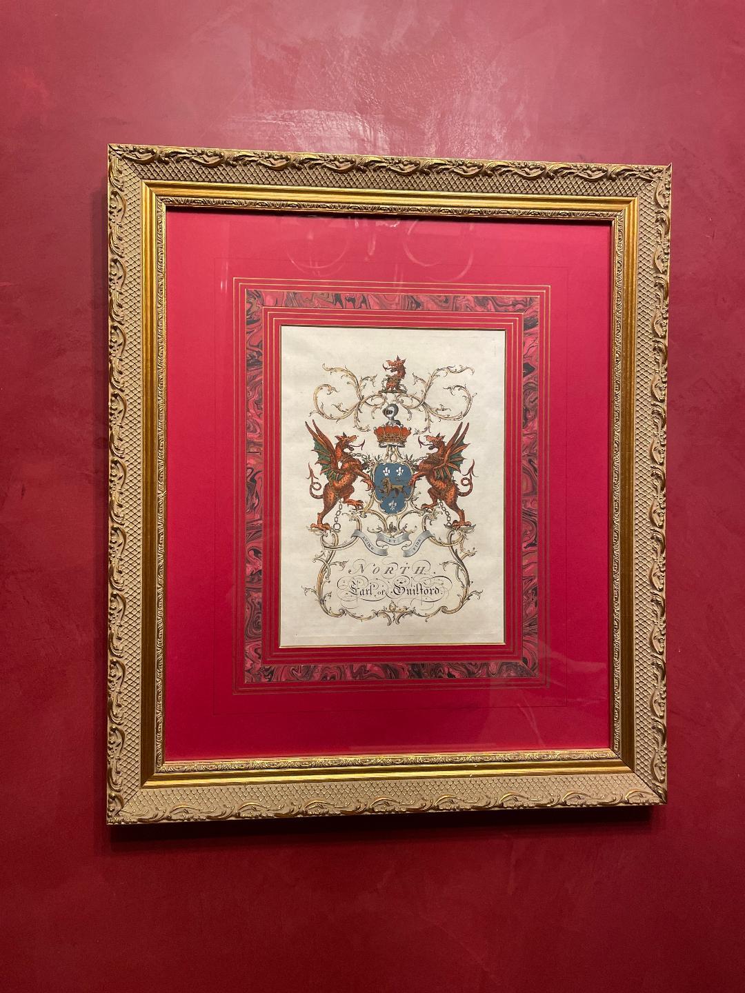 Heraldry crests emblazoned with red, blue, and pale colors.
Hand-colored in watercolor.
Striking style and impressive detail.
Beautifully framed.

Titles of each engraving:
Earl of Cardigan
Earl of Sandwich
Fritz Williams
North Earl of Guifford