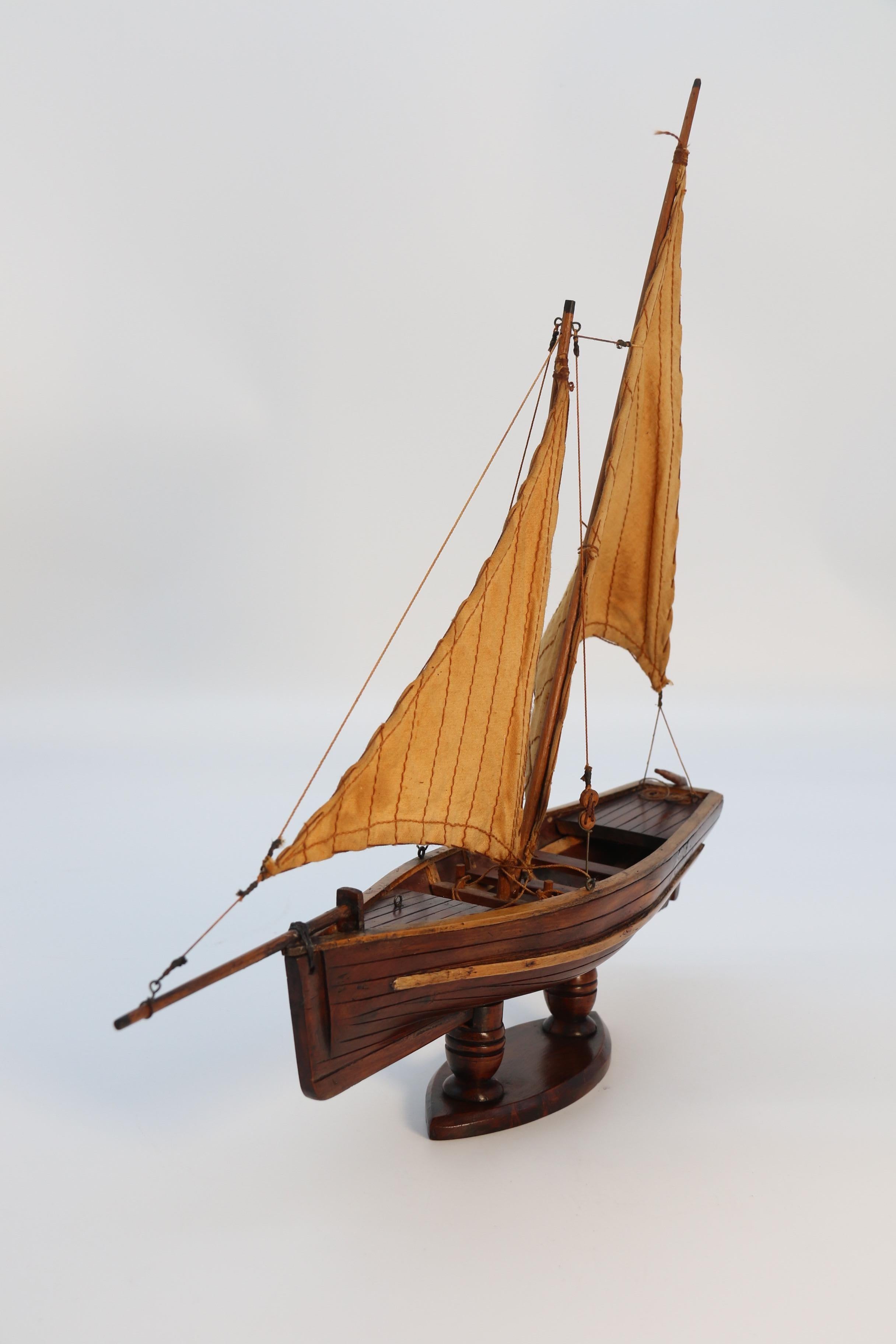 Edwardian English handmade yew wood model of 19th century sailing boat, circa 1900