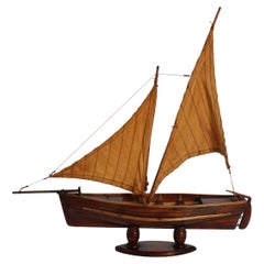 English handmade yew wood model of 19th century sailing boat, circa 1900