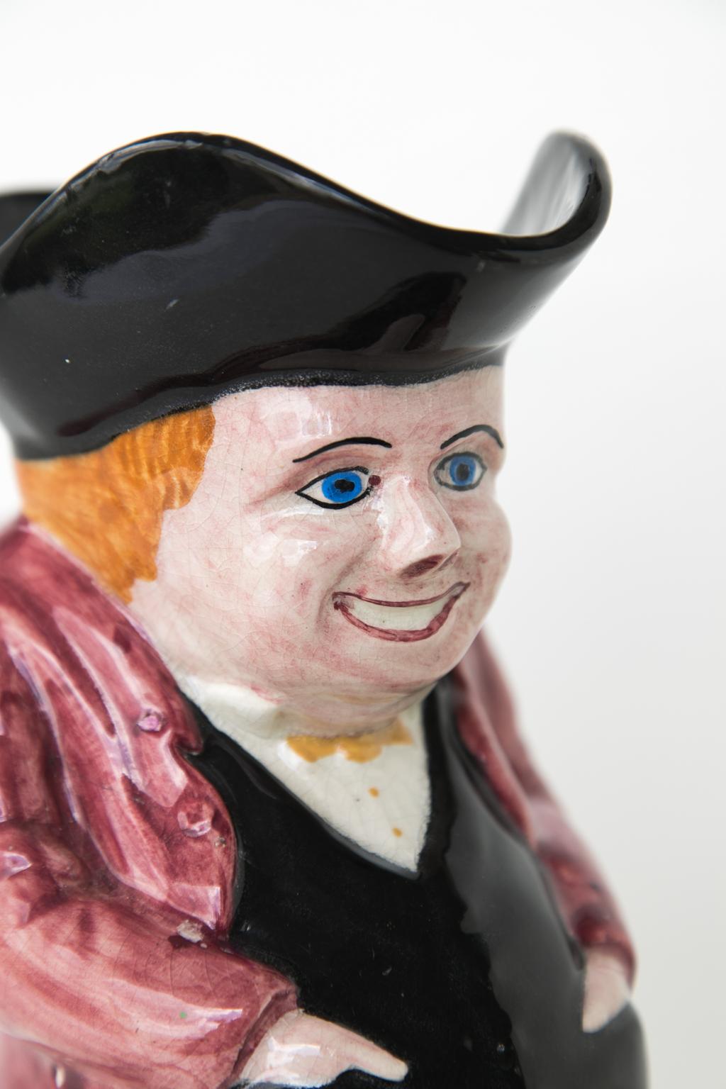 English happy Toby jug, with his hands in his pockets and a variety of colors.