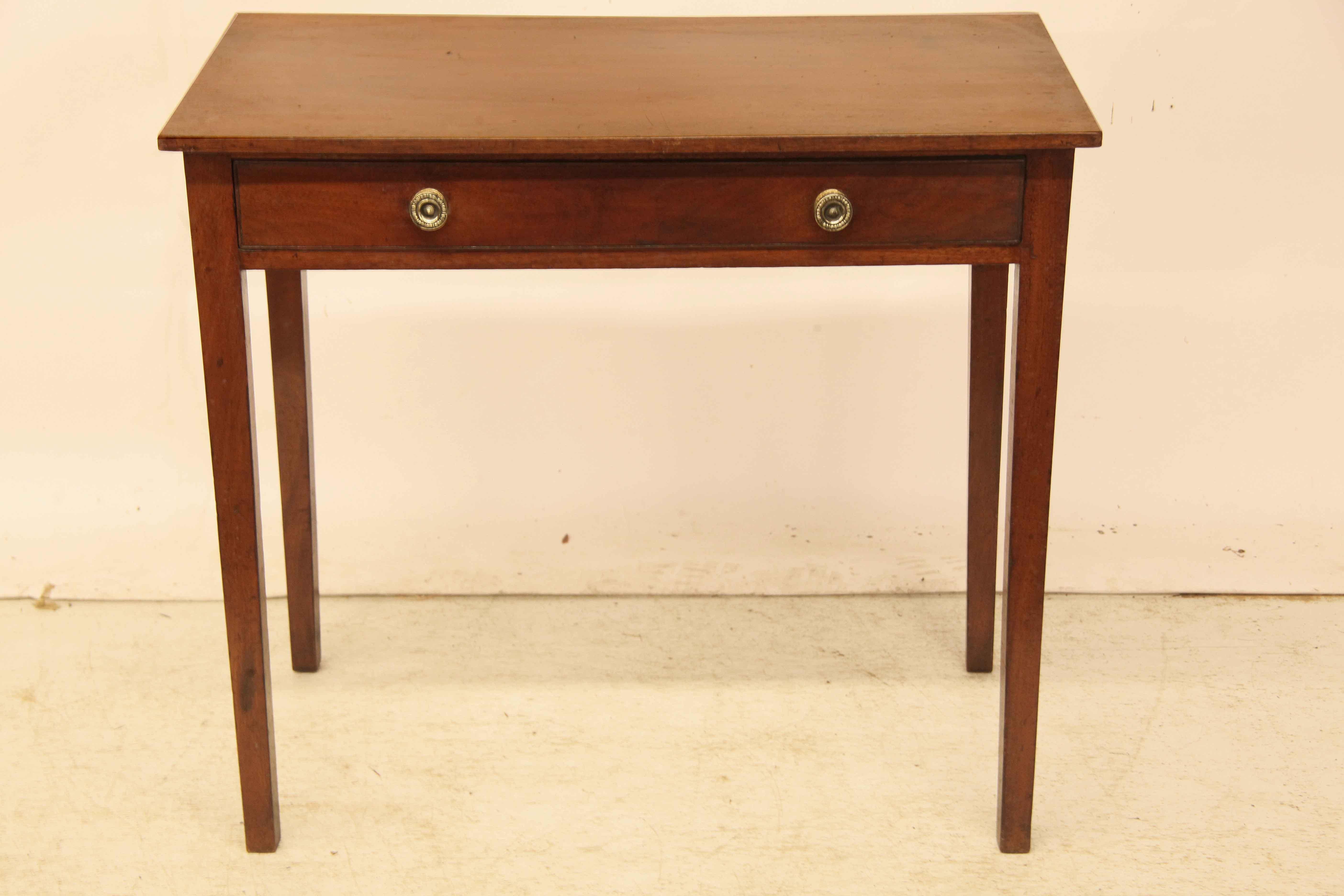 English Hepplewhite one drawer table has beautiful color and patina throughout,  single drawer with incised line molding retains the original brass knobs,  the secondary wood is pine;  the slender square legs are nicely tapered .  With a floor to