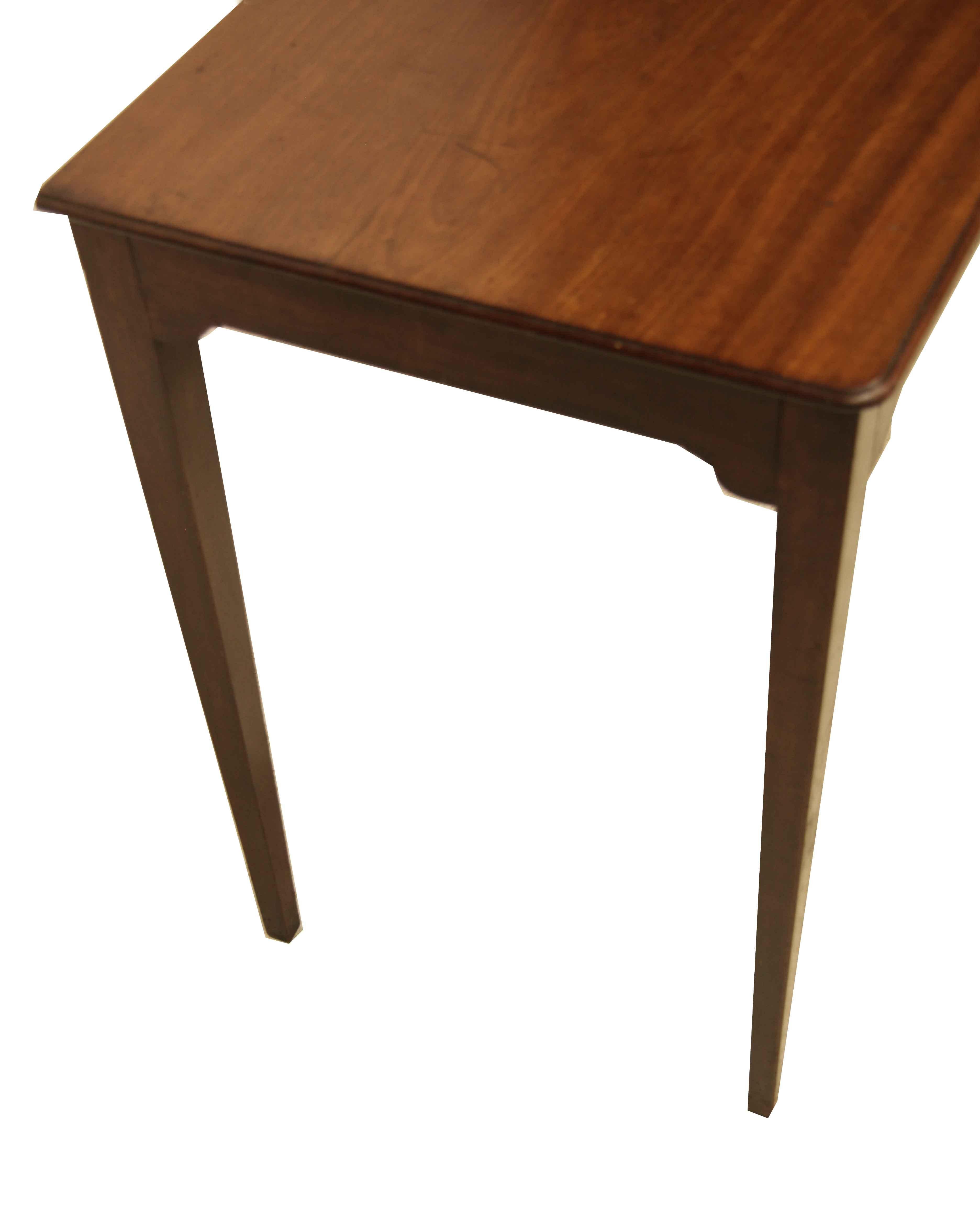 English Hepplewhite side table, the top has a beautiful faded color and patina with molded edge and slightly rounded front corners. The four legs are delicate but sturdy and are nicely tapered. This table defines simple elegance, and there is ample