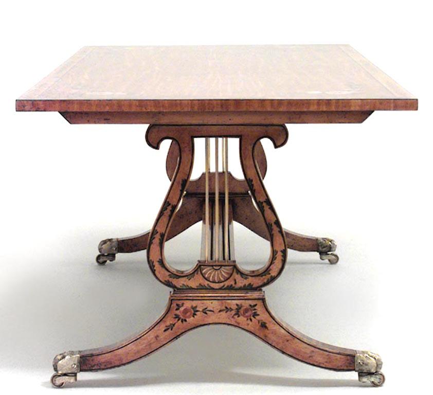 English Hepplewhite-style (20th Century) rectangular satinwood coffee table with floral tabletop design, double lyre design base with stretcher, and brass trim.

