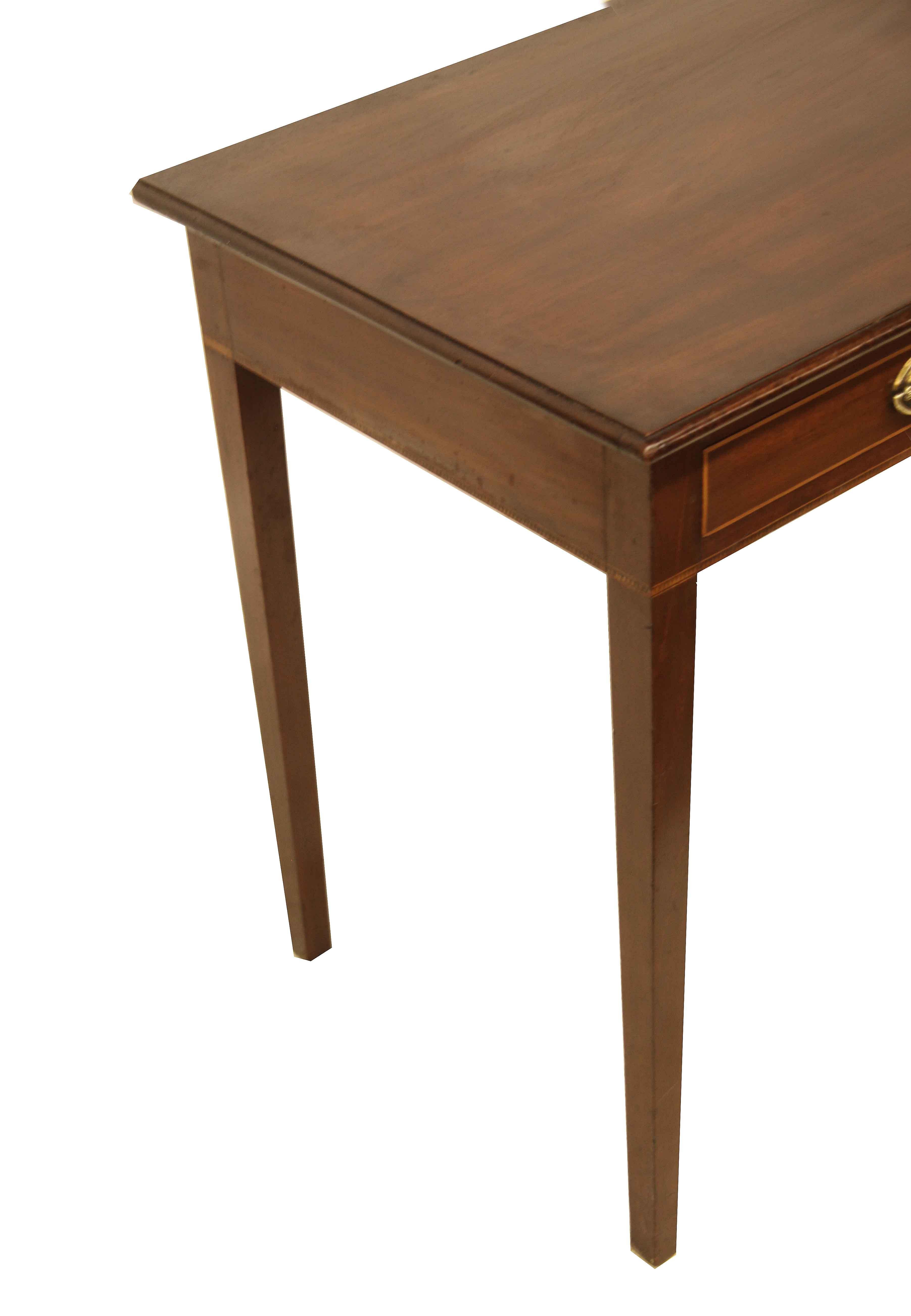 English Hepplewhite two drawer side table , the top with beautiful color and patina and a ''bull nose'' shaped molding;  the two drawers retain the original oval Hepplewhite brass pulls, the perimeter of the drawers are edged in boxwood; below the