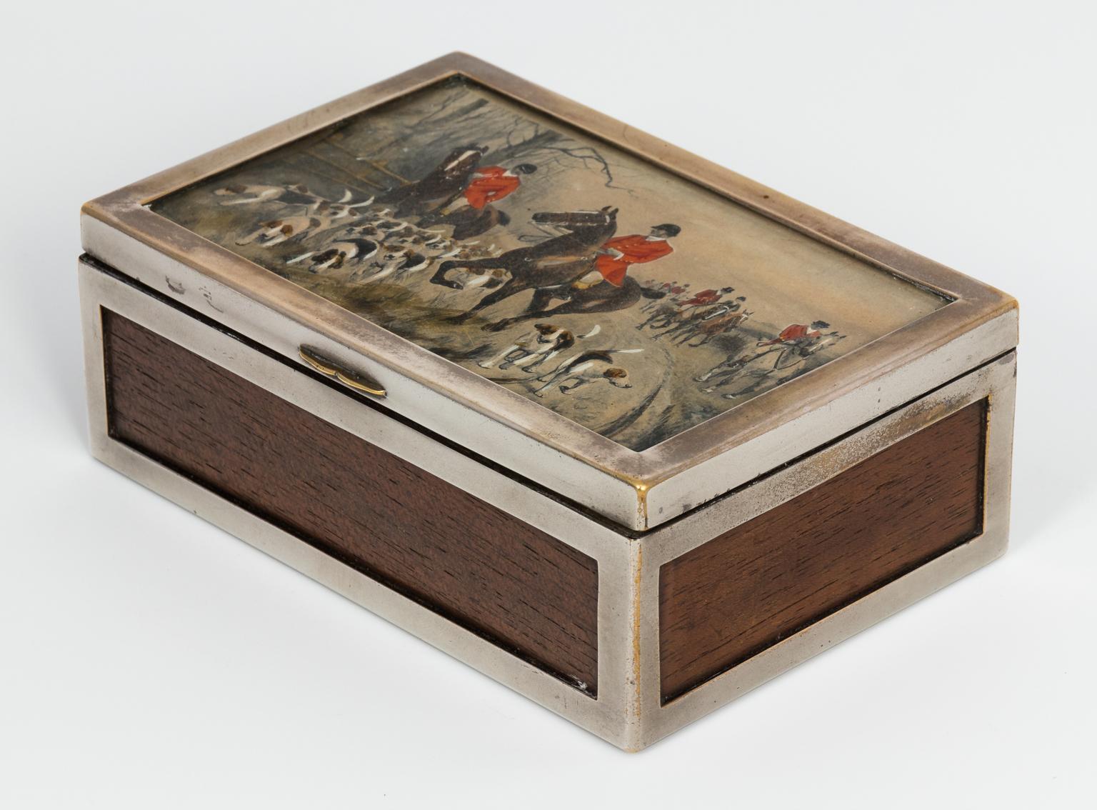 English wood box with silver plate frame featuring a painted English hunt scene, circa 1930s.
 