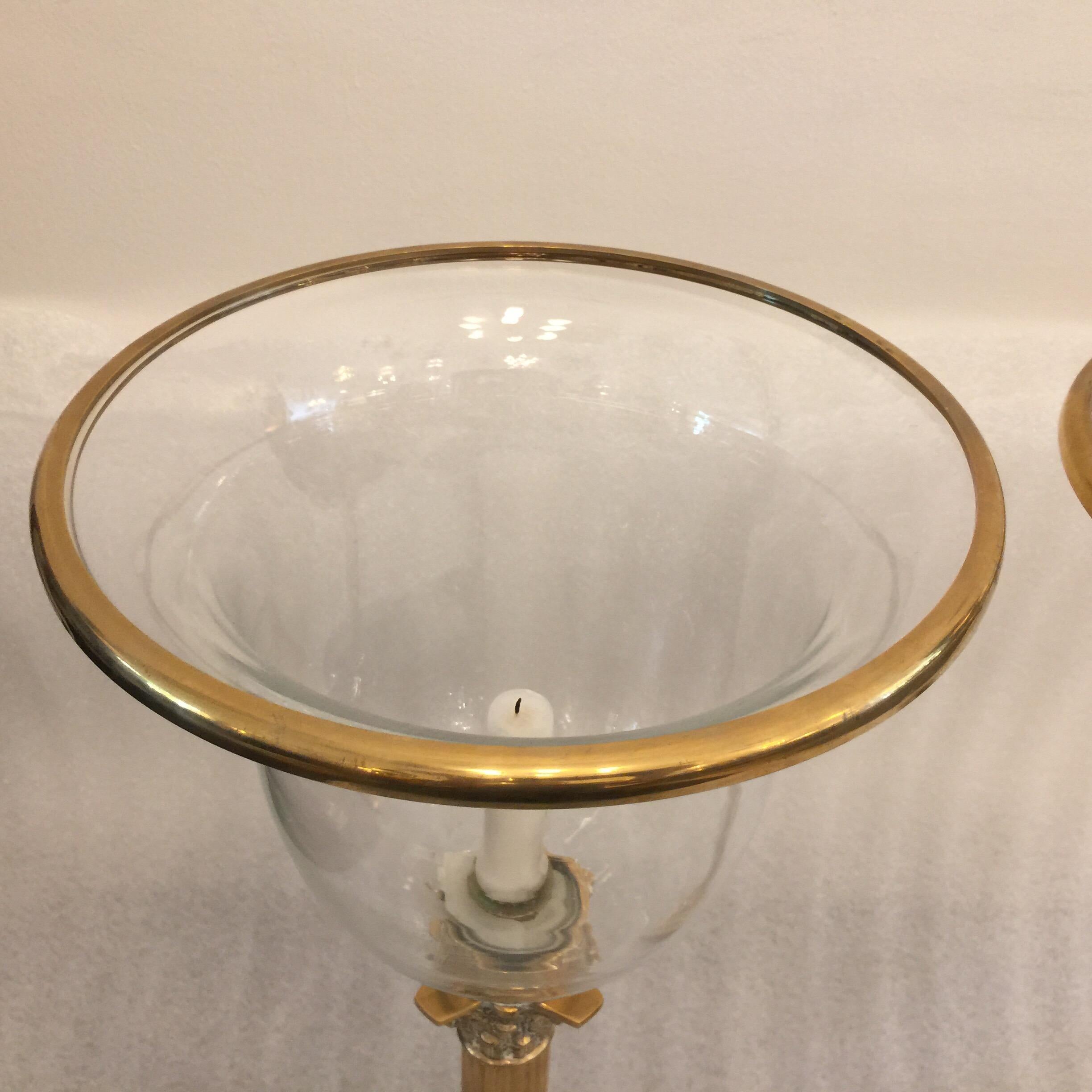 These are handblown glass difusers with original brass trim top and wonderfully patinated brass Corinthian column bases. Very heavy and beautiful.

The matching lantern is slightly shorter by 1/2 inch. Visible in the pics provided. Not noticeable