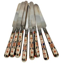 English Imari Style Porcelain Handled Silver Table Knives, a Cased Set of Eight