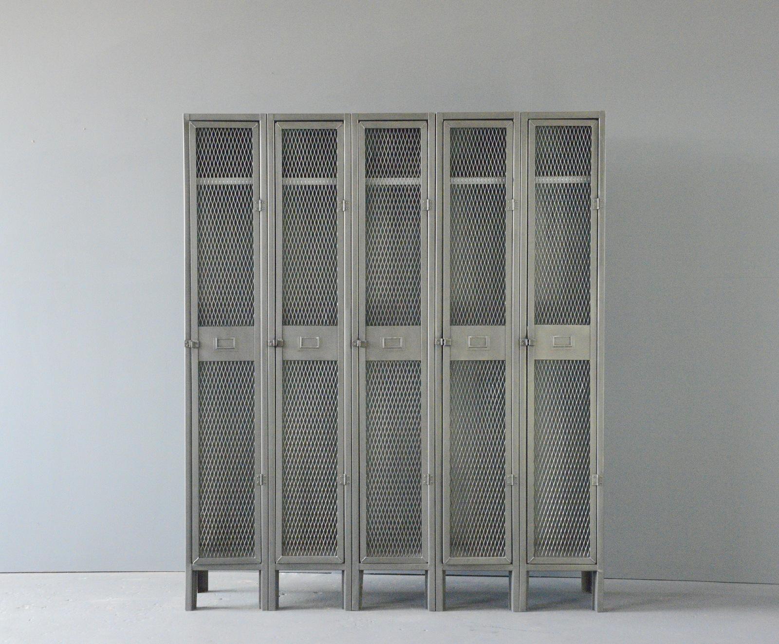 English Industrial Lockers, circa 1940s

- Sheet steel with mesh front doors
- 5 Doors
- Each compartment has hanging hooks and shelf
- Salvaged from an engineering works in Birmingham
- English ~ 1940s
- 154cm wide x 31cm deep x 182cm