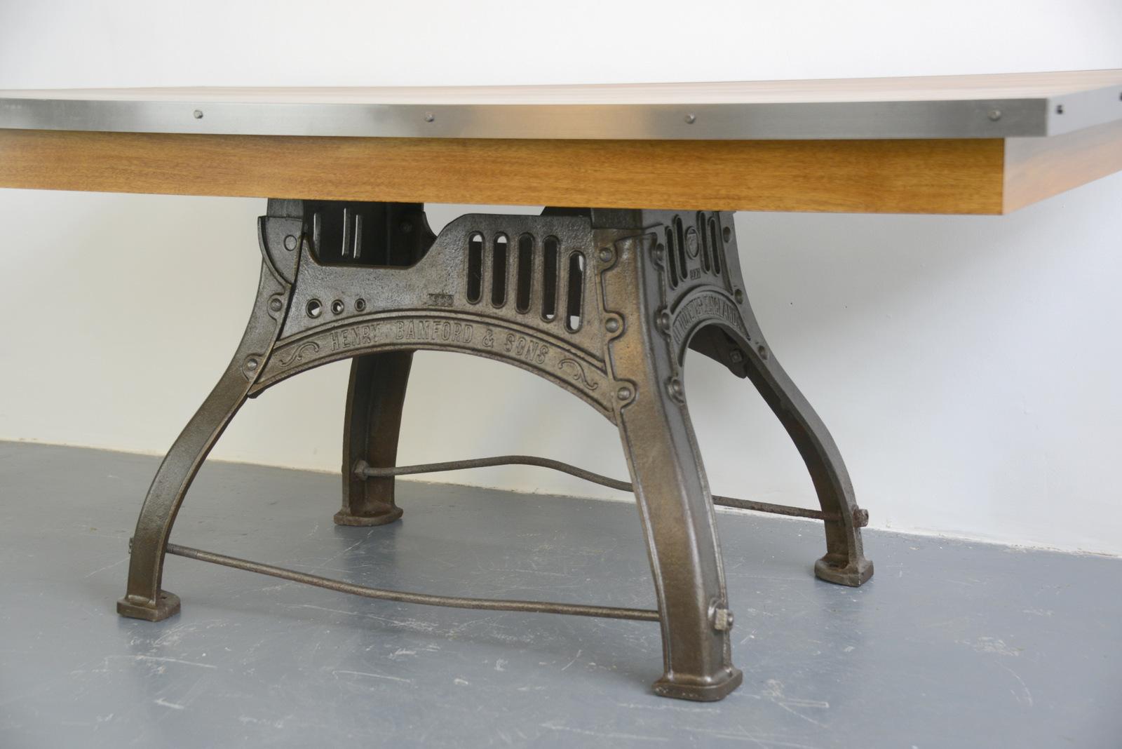 English industrial table by Bamfords, circa 1910

- Will seat 6-8
- Cast iron base
- Beautiful brandning on all 4 sides
- Steel edging 
- Solid hardwoood top
- The top is made from idigbo 
- The top has been finished with numerous coats of
