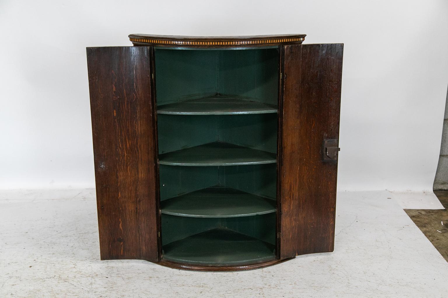 Late 18th Century English Inlaid Bow Front Hanging Corner Cupboard For Sale