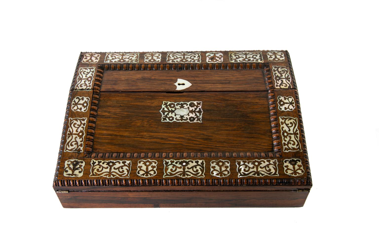 English inlaid lap desk, the slanted double lid opens to a tooled leather writing surface at the front and a fitted area for pens at the top (it would have had glass inkwells in the upper corners originally); the lids are inlaid with mother of pearl