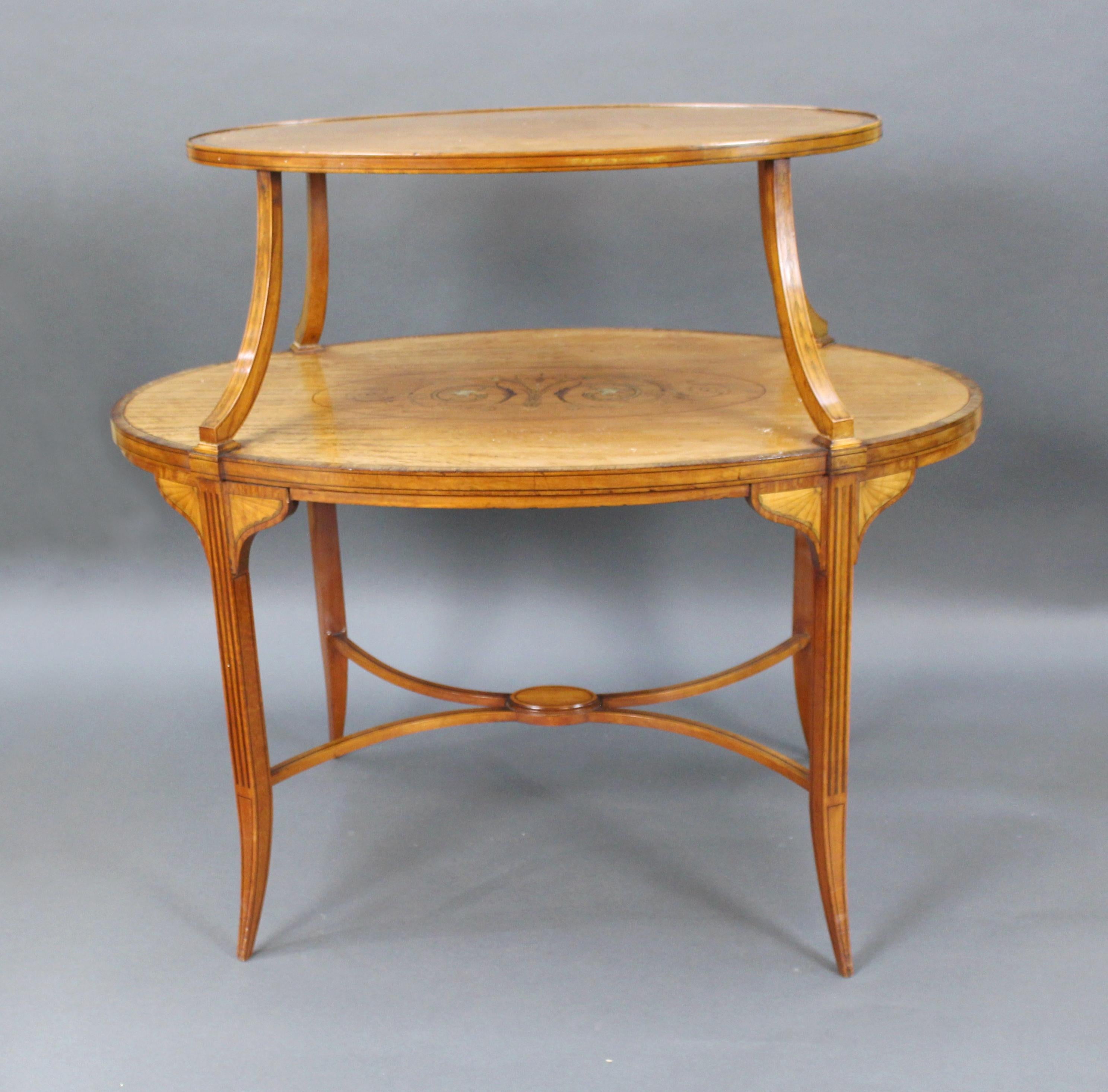 Period: Late 19th century

Wood: Satinwood, inlaid

Condition: 
Very good condition commensurate with age. Nice color. Sturdy, one or two old repairs to the frame.
 
Lovely looking oval two tier satinwood étagère

Attractive mellow patina