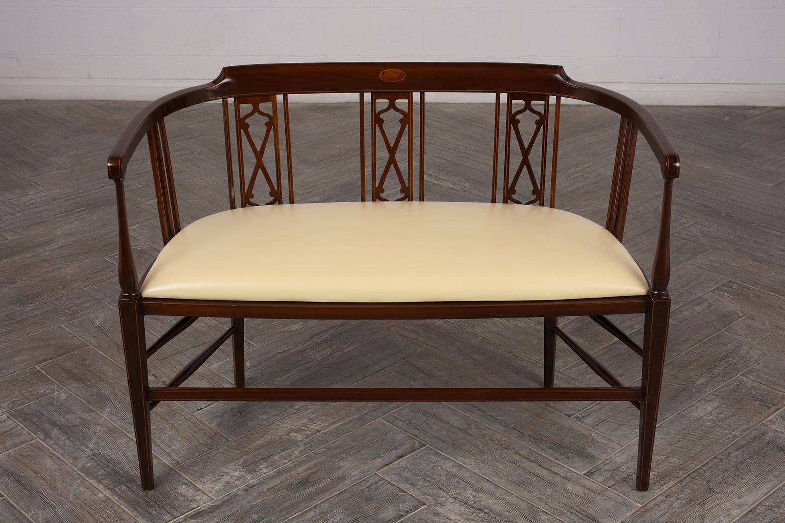 This English Inlay Regency Bench has been fully restored, made out of solid mahogany wood, and features its original rich dark walnut stain with a lacquered finish. The bench also has an inlay design, curved backrest, and the seat has been newly