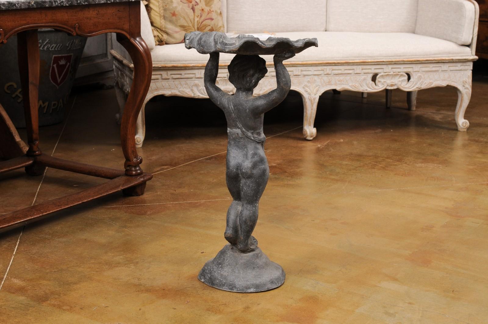 English Iron Greco-Roman Style Standing Cherub Carrying a Sea Shell Bird Bath For Sale 4