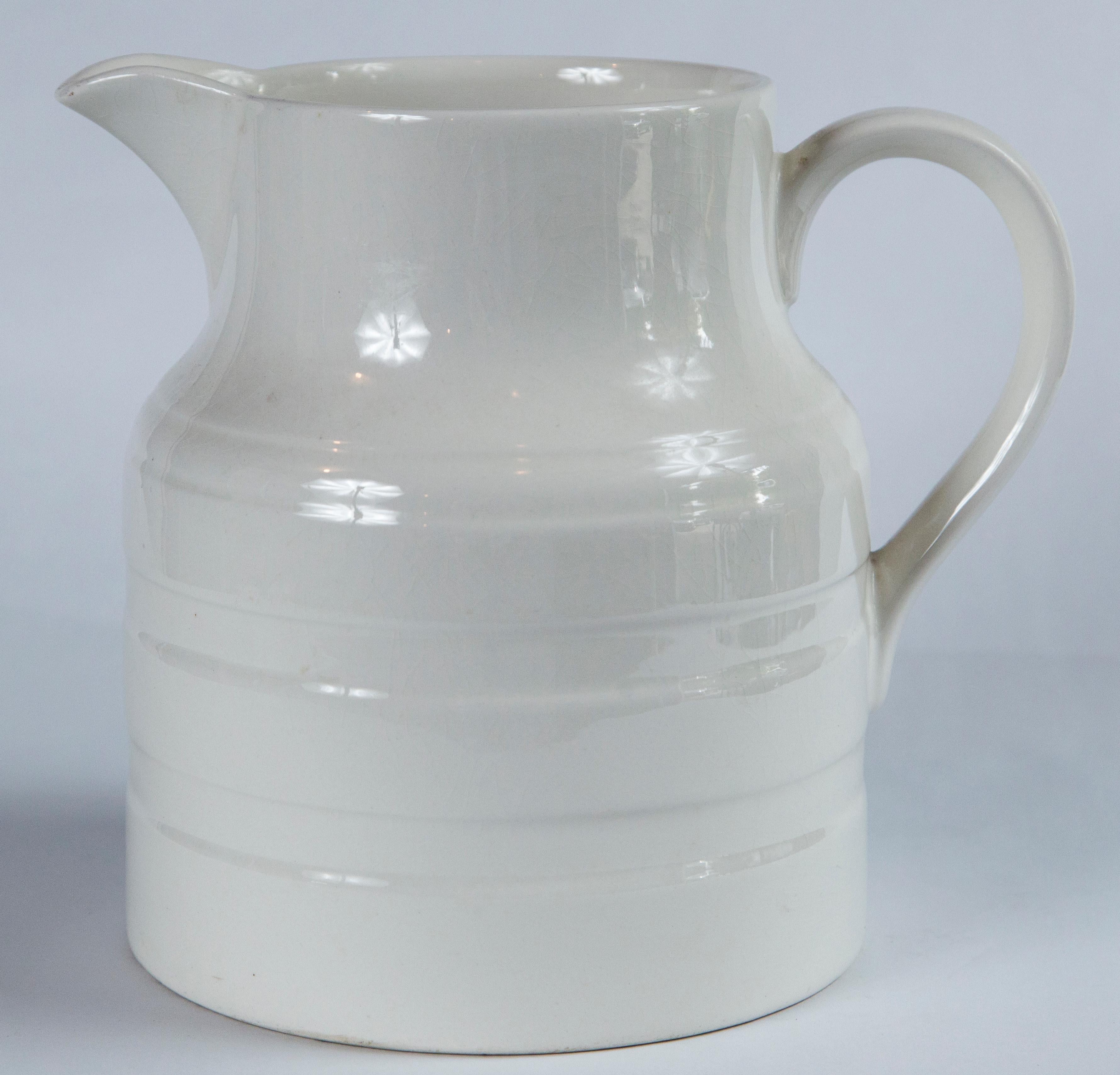 English Ironstone Dairy Pitcher, circa 1920. Extra large 7 pint size with raised band design. Manufactured by Lord Nelson Pottery, England.