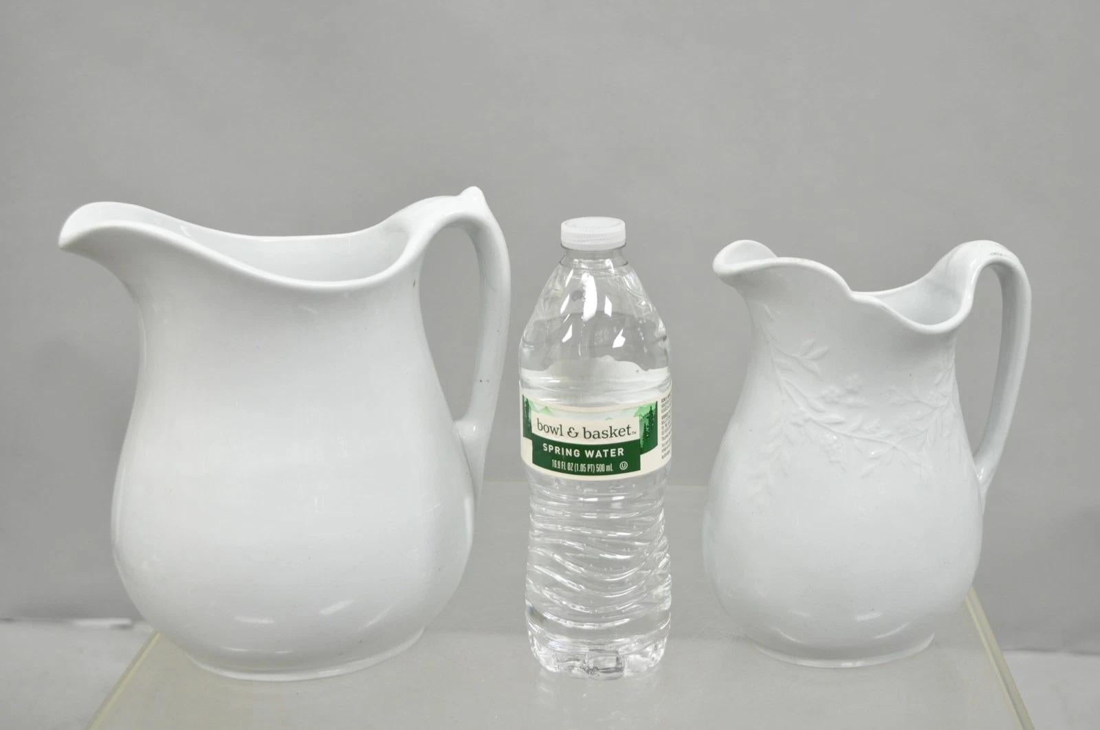Vintage English Ironstone Imperial Hope & Carter and Burgess & Goddard Farmhouse Water Pitchers - Set of 2. Circa Early 20th Century. Measurements: Large: 8