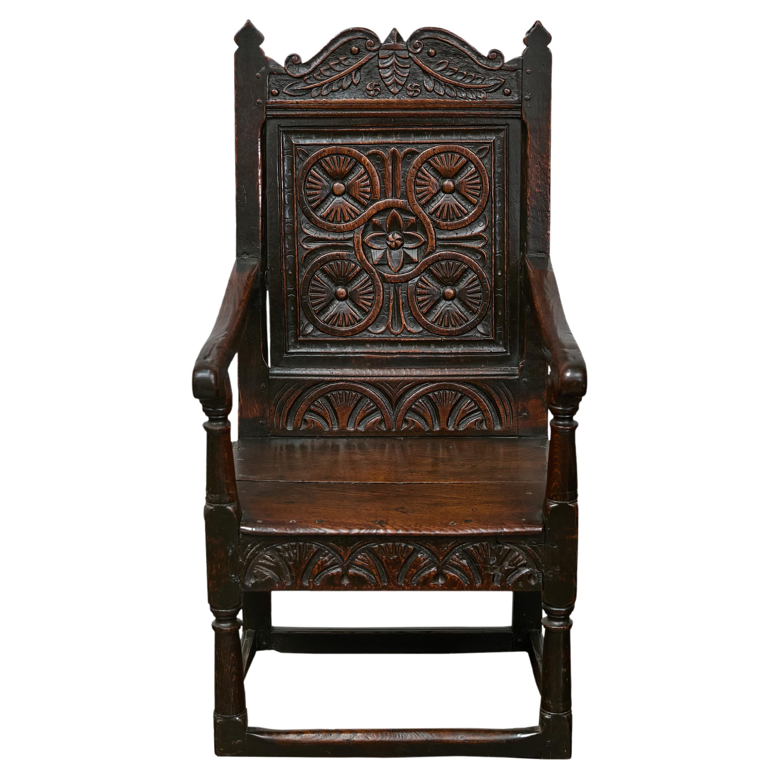 English Jacobean 1690s Oak High Back Armchair with Carved Décor and Turned Legs For Sale