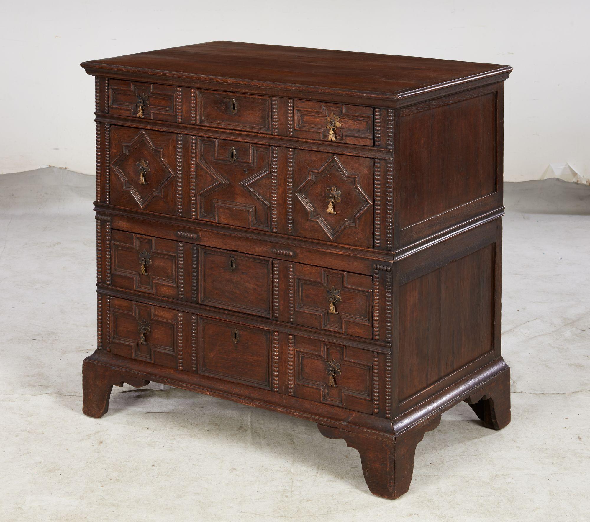 Fine English 17th century oak chest of drawers having geometric molded drawer fronts and split turned applied decoration, the case of typical two-part construction and standing on 18th century bracket feet, the whole with good rich color and
