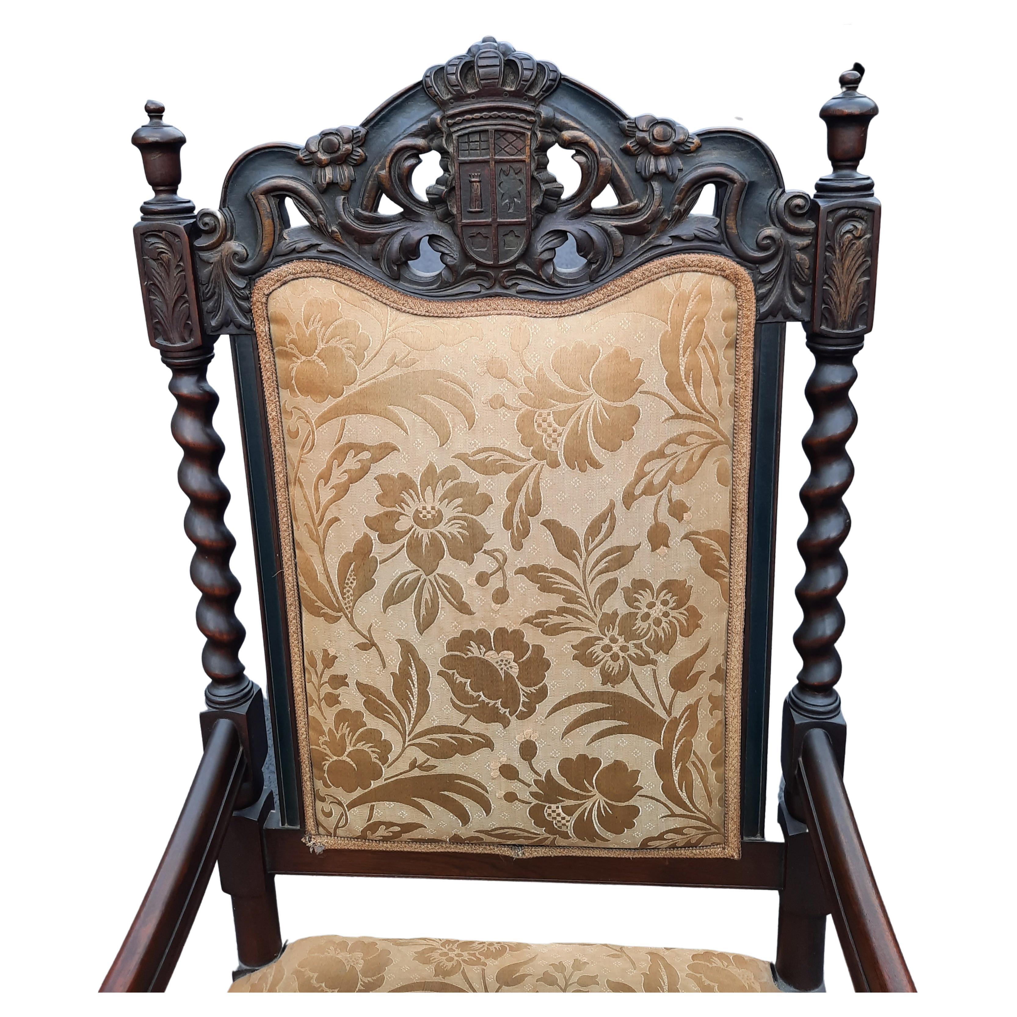 Stunning 19th century English Jacobean armchair. Chairs feature ornate spiral carved barley twist in oak. lower stretcher, intricate carved back and urn form finials. Very impressive hand-carved chairs with remarkable execution. Upholstery shows