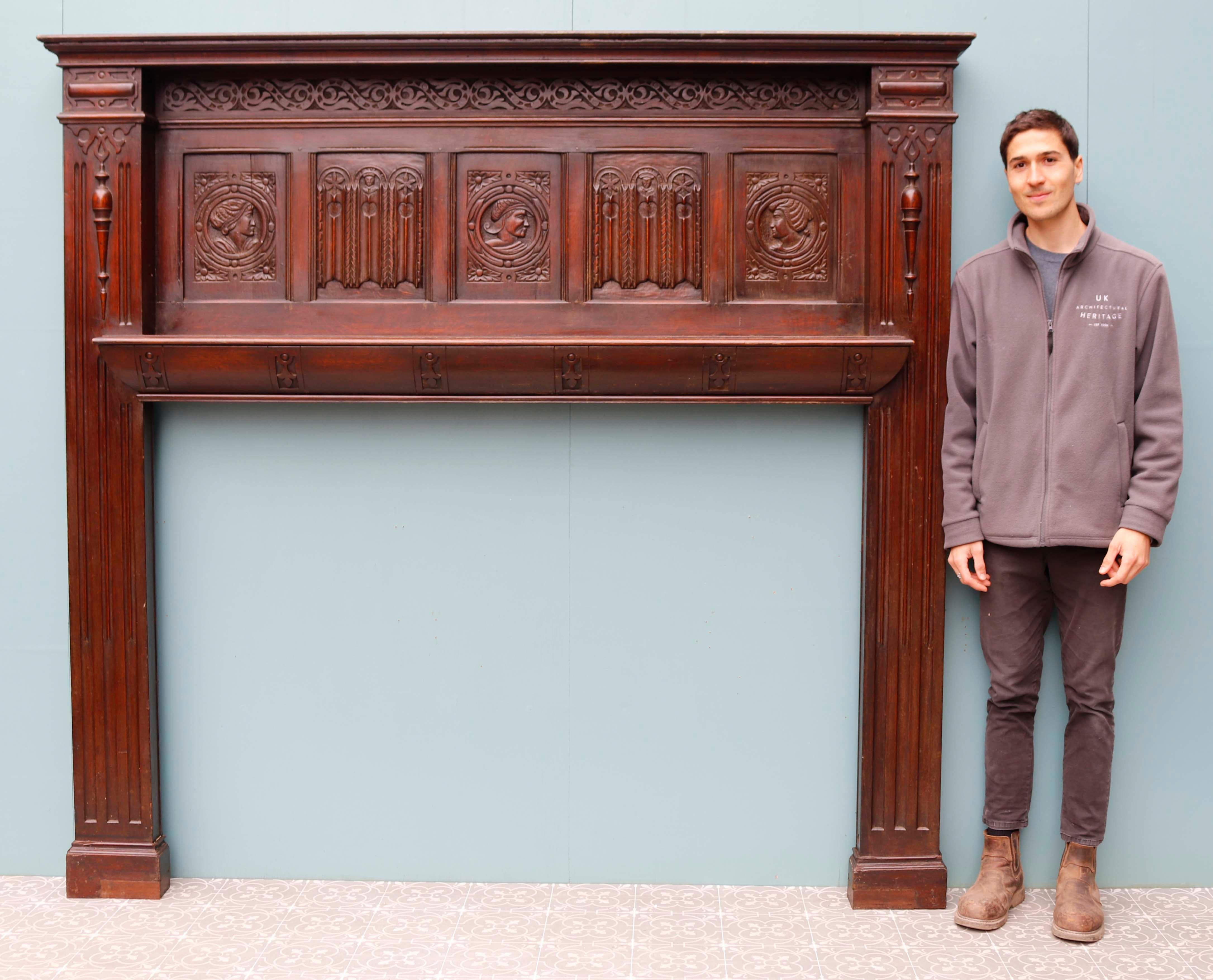 Large English Jacobean style carved oak fireplace. The frieze panel carved with stylised heads.

Additional Dimensions 

Opening Height 118 cm

Opening Width 167.5 cm

Width between outsides of the foot blocks 208.5 c.