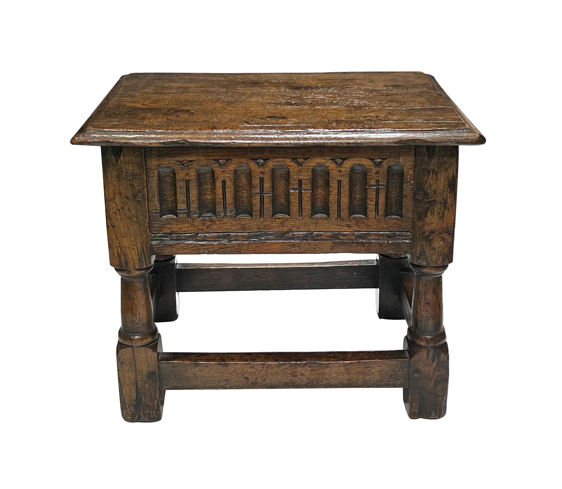 the rectangular top with quarter-round molded edge above a fluted apron; raised on turned columnar supports ending in block feet all joined by perimeter stretchers