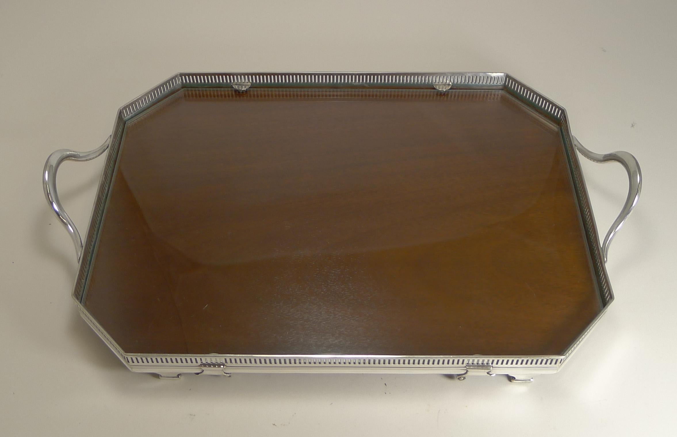 Always highly sought after and scarce to find, this is a wonderful tray converting from a glass covered mahogany tray to a classic clean glass tray.

This one has just come back from the Silversmith, where it has been professionally polished. It