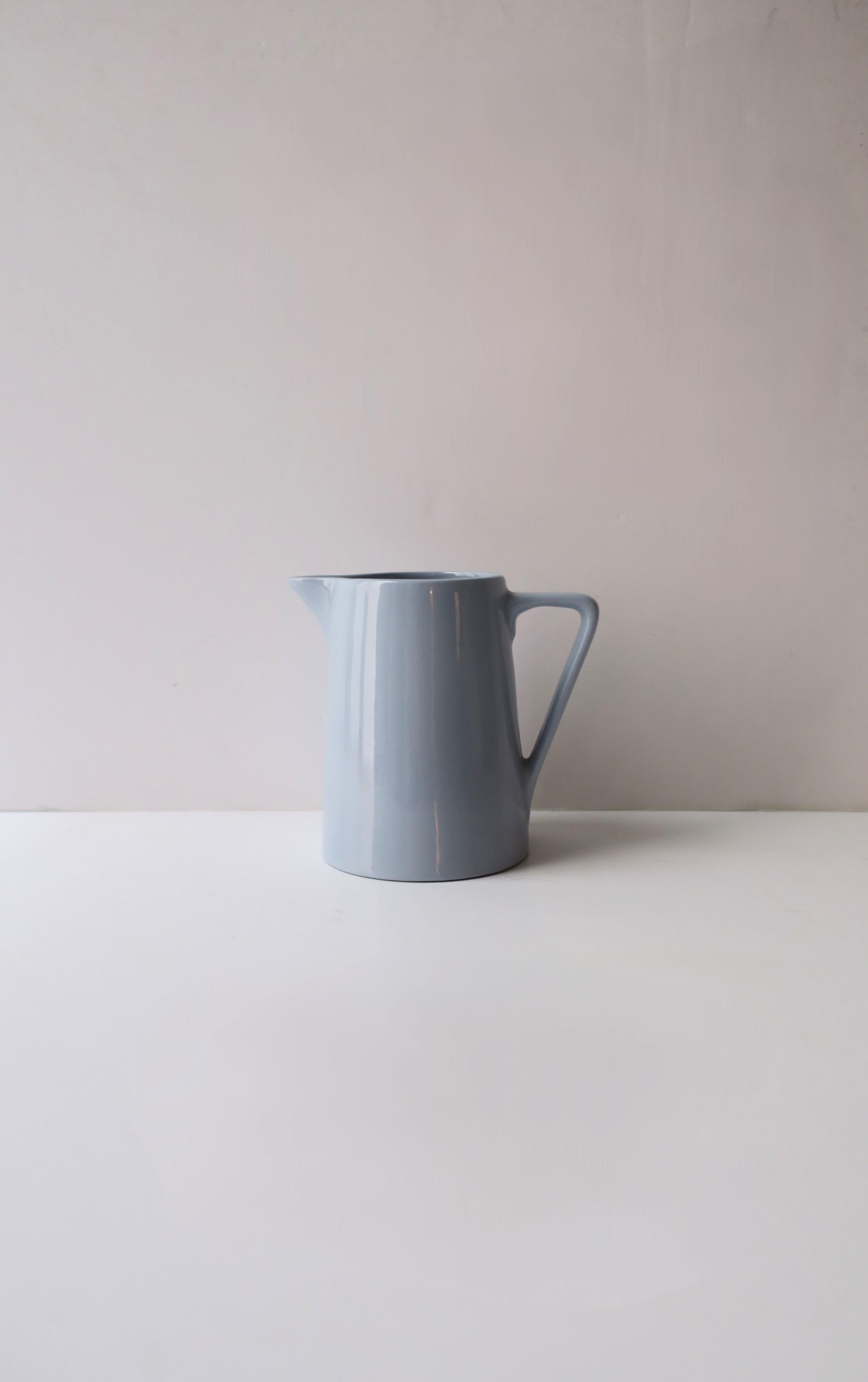 An English blue (cornflower blue) ceramic pitcher, Art Deco period, by Johnson Brothers, circa early-20th century, England. Beautiful as a standalone piece, for liquids, as a vase, etc. Many uses. Marked on underside as shown in last image; 'Johnson