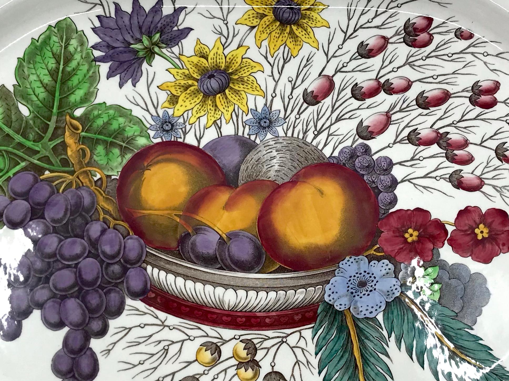 English large harvest platter. Large serving platter with fruit basket and flowers in autumnal colors with markings for Copeland Spode. England, mid 20th century. 
Dimensions: 16.5” W x 13” D x 1.75” H.