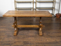 English Late 19th Century Oak Farm Table with Carved Trestle Base