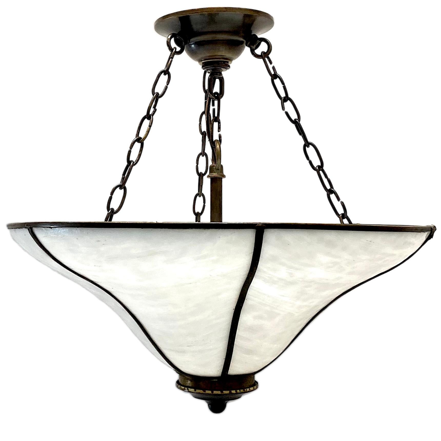 A circa 1930's English leaded glass light fixture with four interior lights.

Measurements:
Diameter: 17