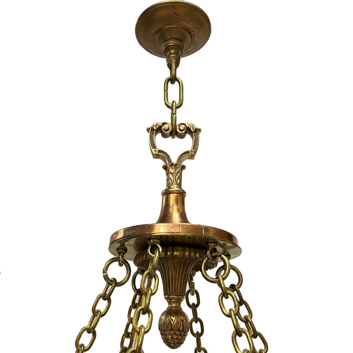 A circa 1920's leaded glass light fixture with 6 interior lights.

Measurements:
Diameter: 31