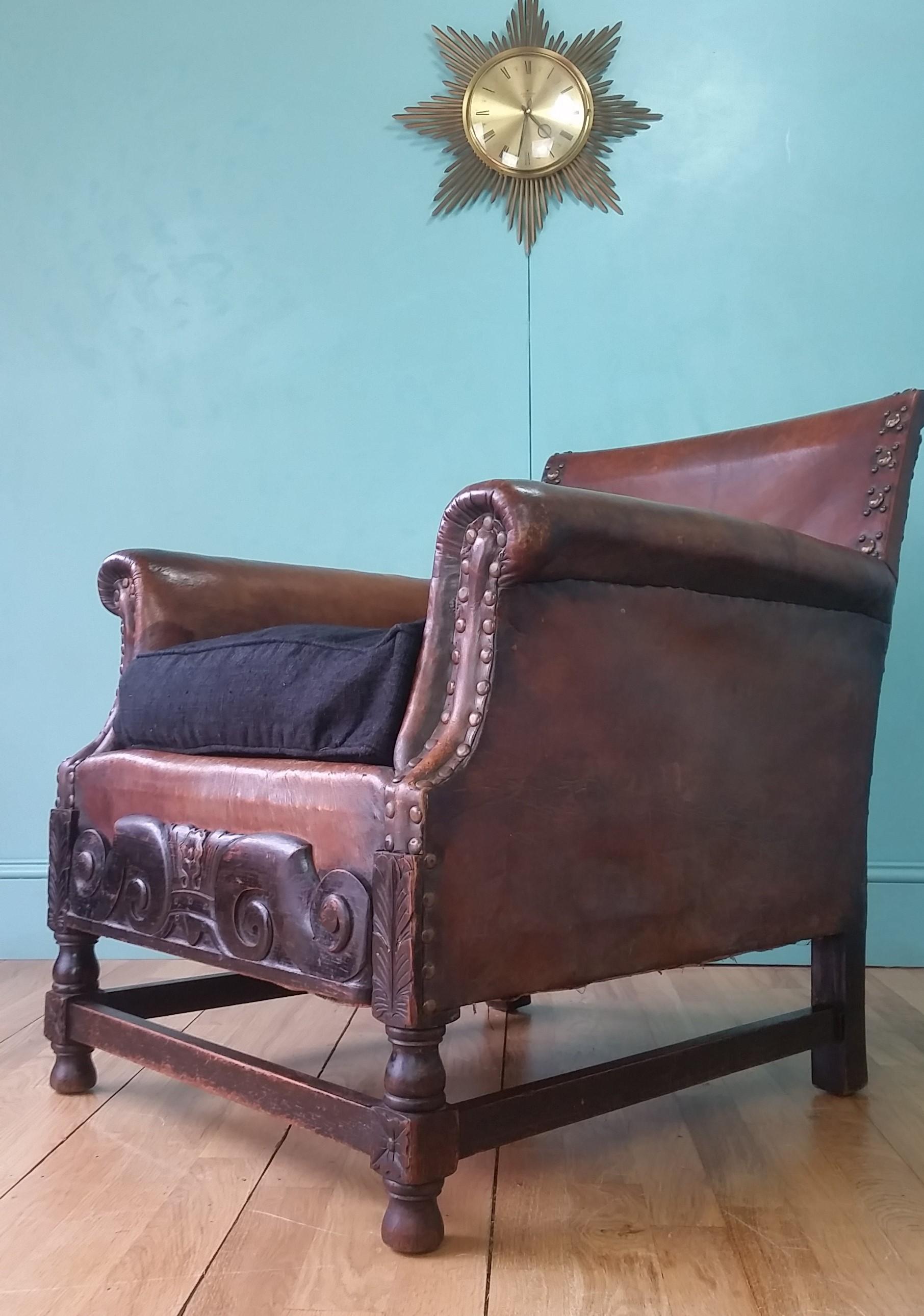 English antique leather armchair circa 1880 - 1900
Designed in the style of the arts & crafts movement (1860 - 1920) with ebonised oak frame, decorative front panel and original brass studs.
In full working order with a firm frame and no damage to