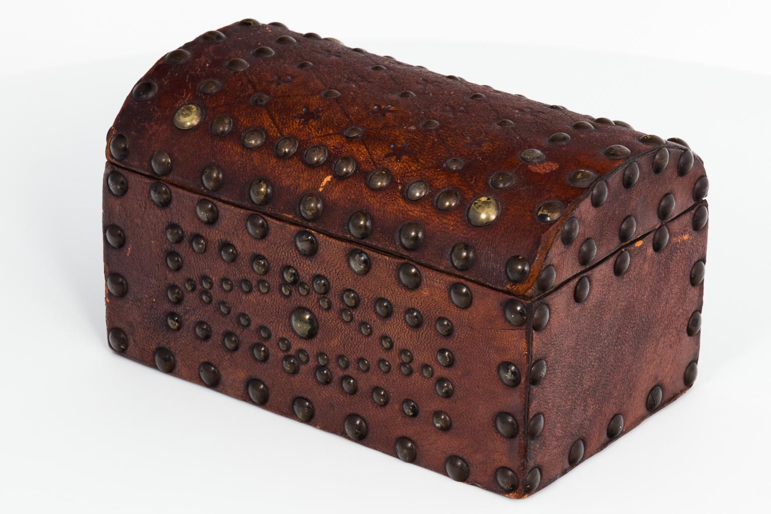English leather box with brass nailhead studs in lozenge designs, circa 1850.
 