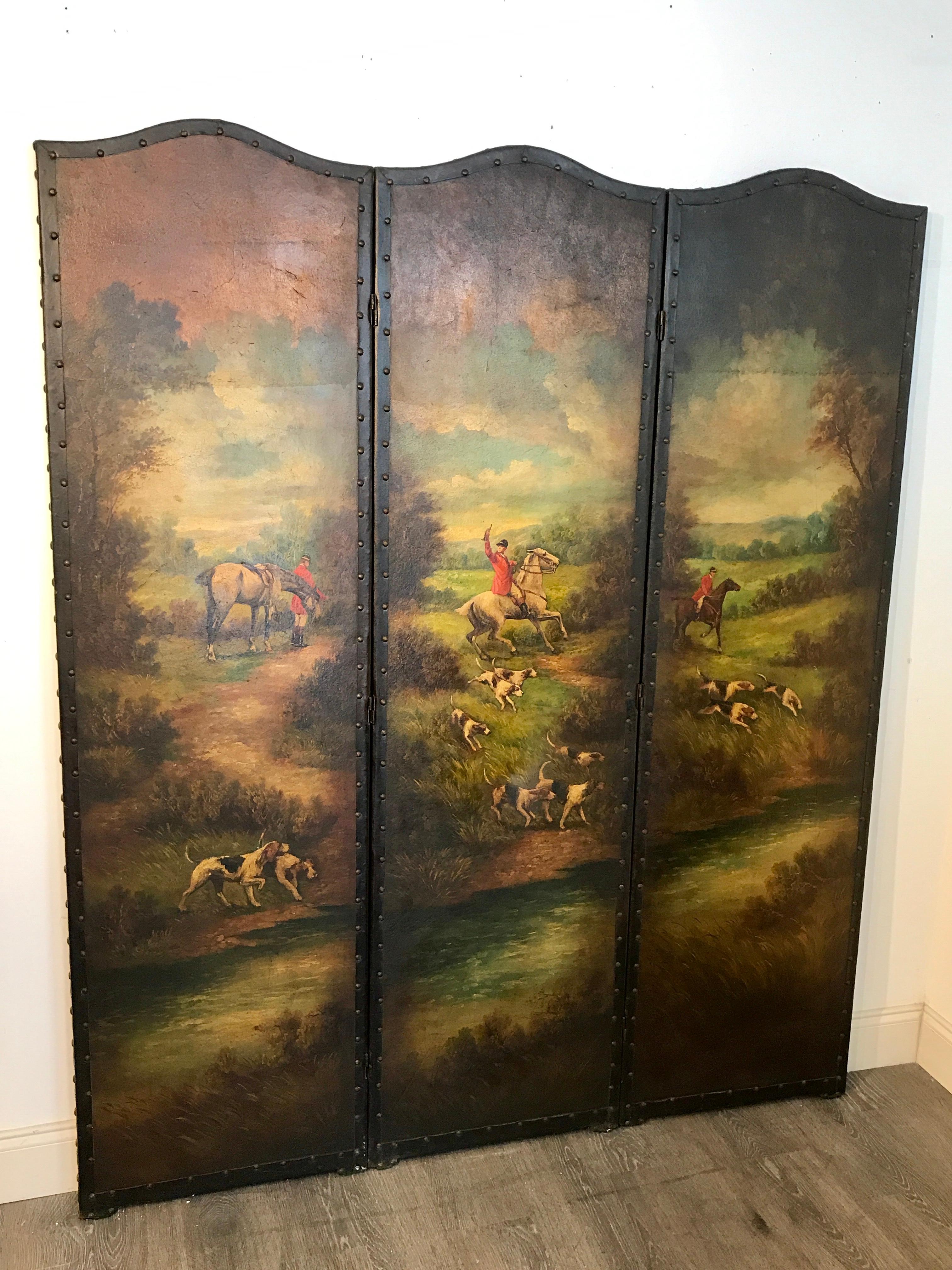 English leather hunting scene three panel screen, consisting of three well painted arched panels with hunting scenes and dogs, in well cared for antique condition, there is a slight blemish in the first panel to the left. On the back there is one