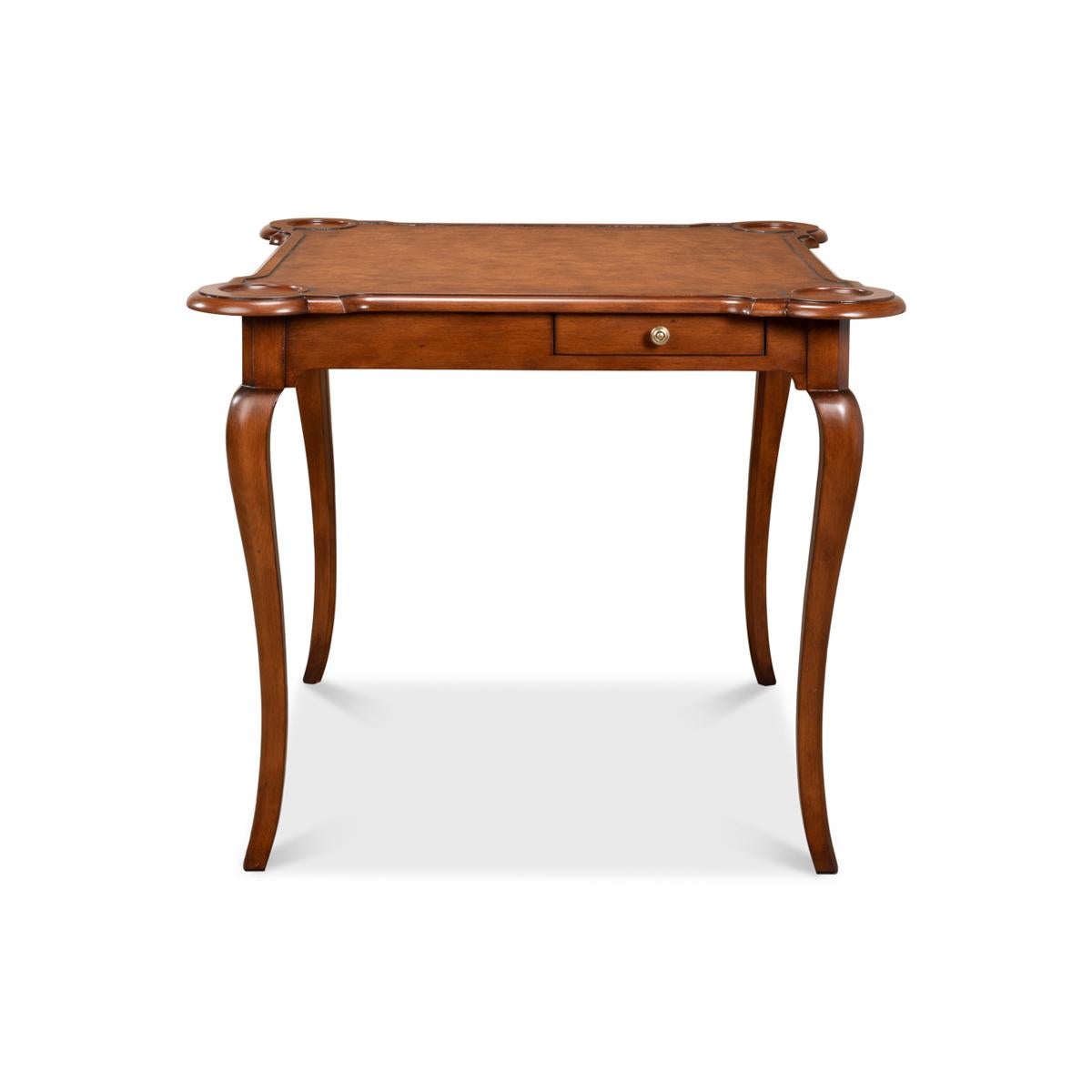 Introducing the English leather top game table, a stunning piece of 18th-century inspired craftsmanship. The table boasts a rich walnut finish that exudes elegance and sophistication. The hand-colored and antiqued leather inset top adds a touch of