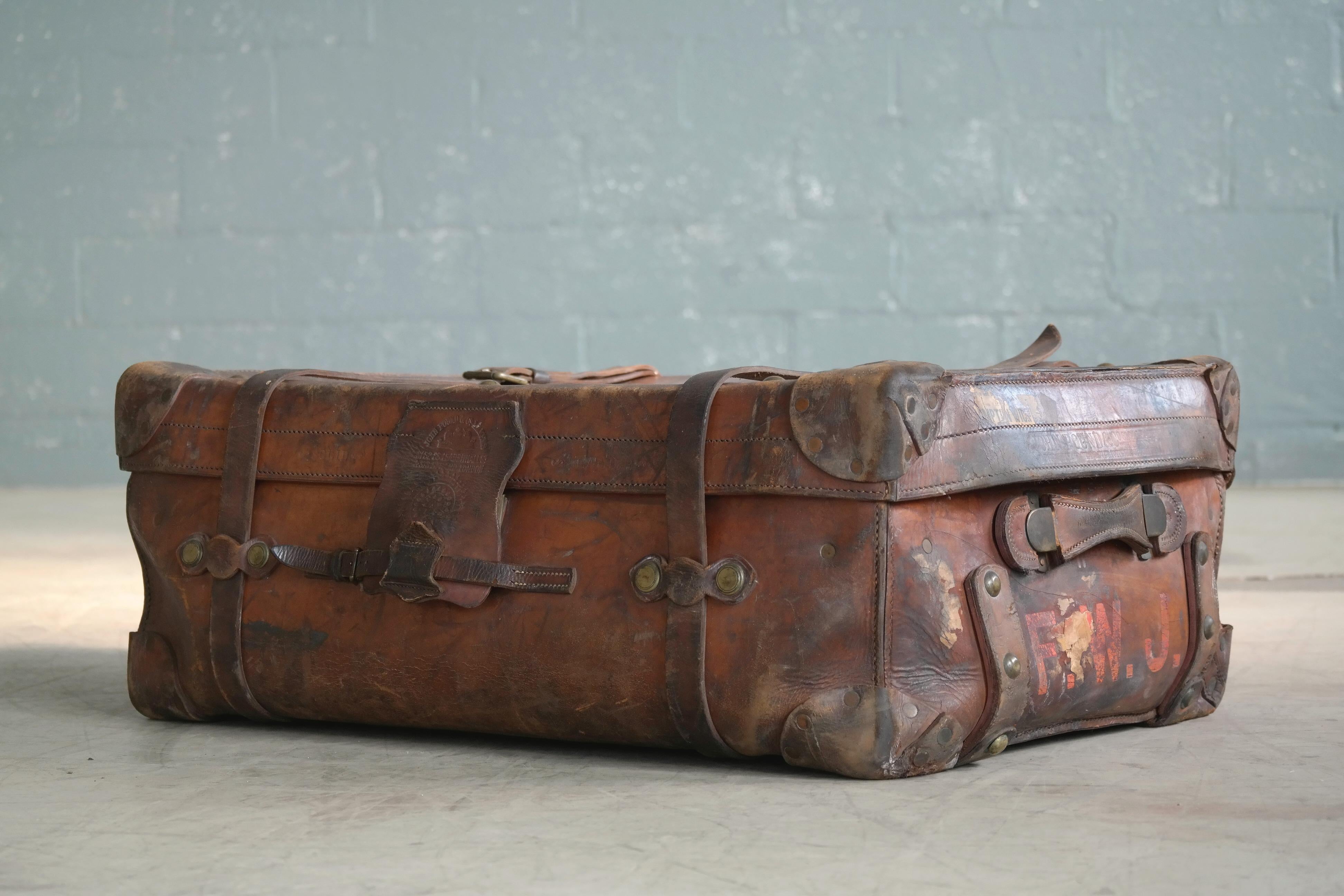 If suitcases could speak and while this fantastic English leather steamer trunk may not speak it does tell quite a story of splendid travel and adventure and the feat of surviving it all including two world wars. Made circa 1883 by legendary John