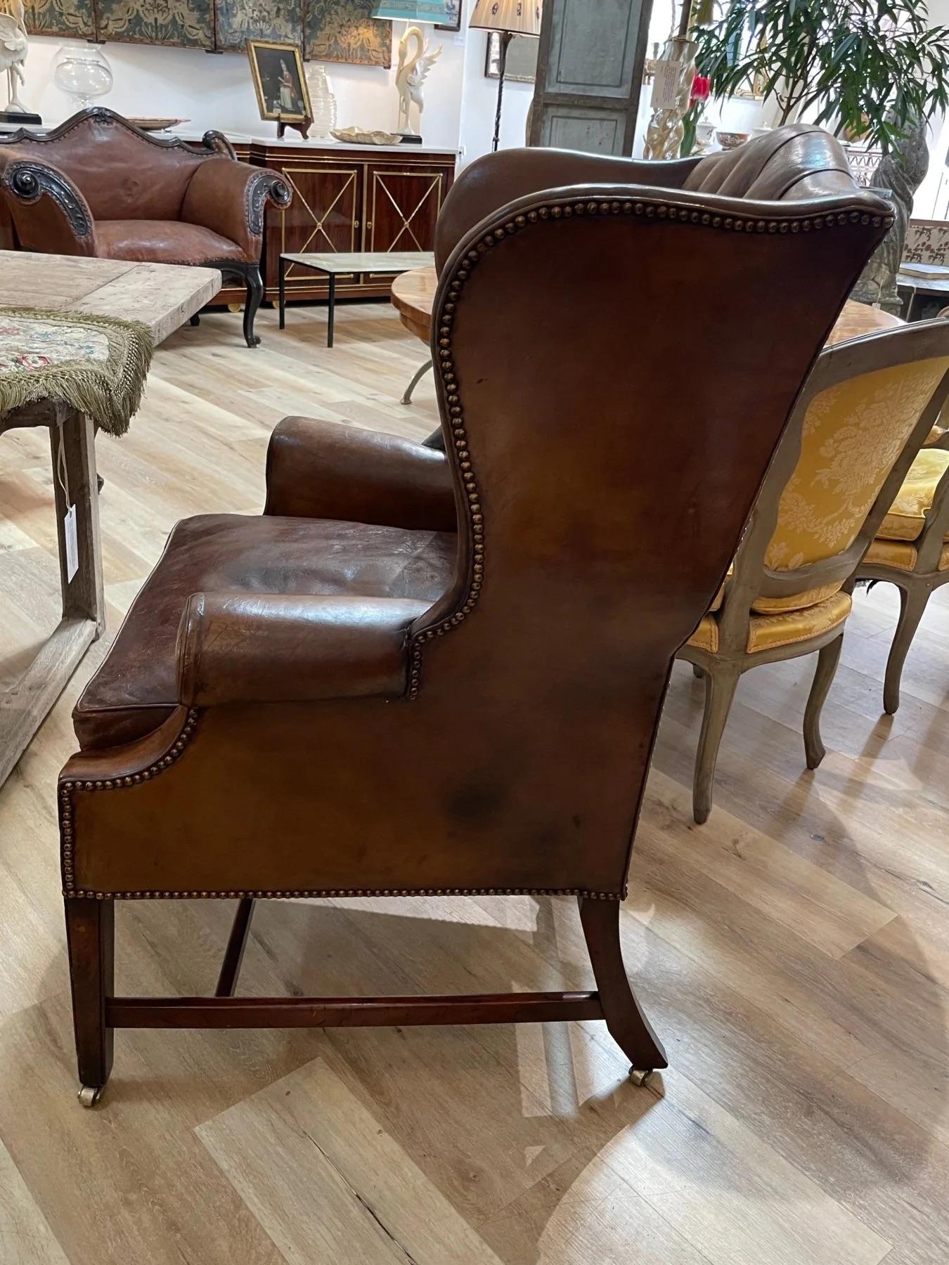 Leather English leather tufted wingback chair, 19th Century