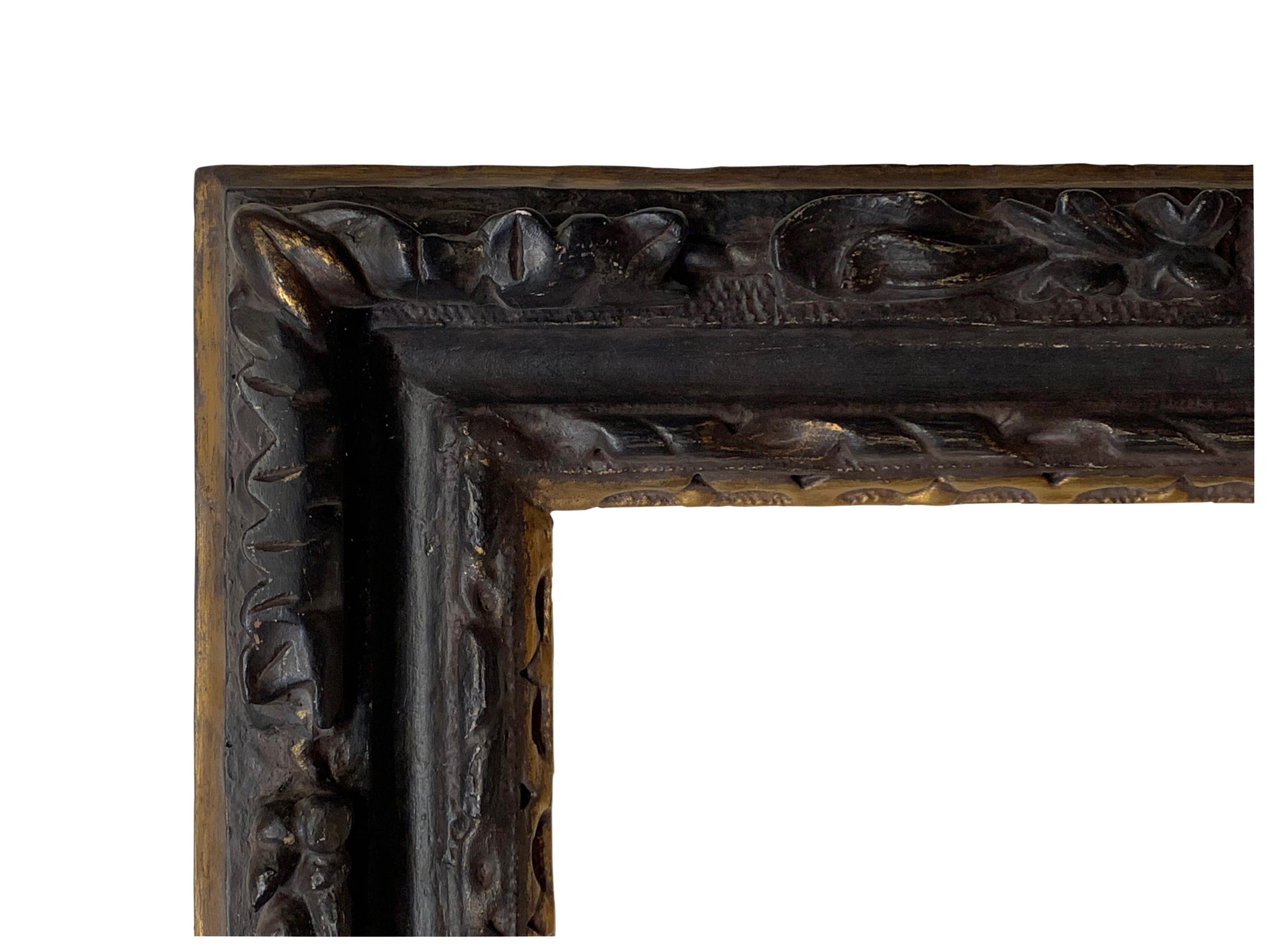 This ebonized frame was carved with an oak leaf and acorn motif in the late 1600s-early 1700s. 

Rabbet dimensions: 26.5
